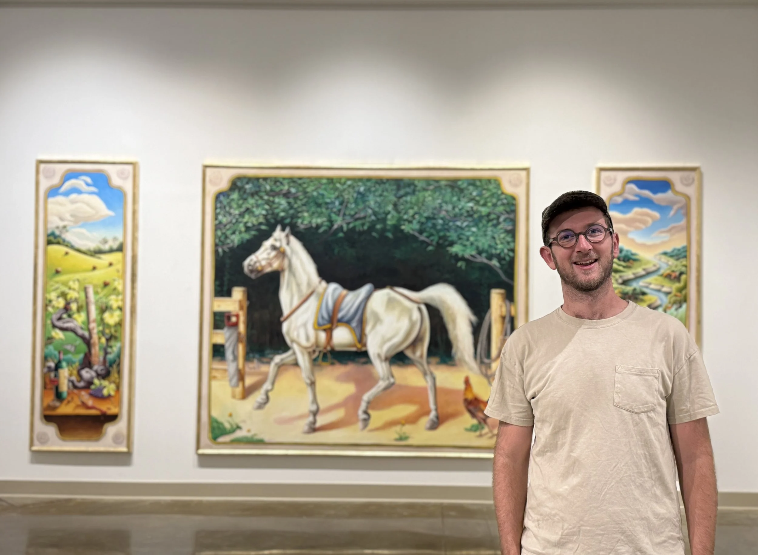 Alabama fine artist Banks Compton standing with his Marengo triptych during his solo exhibition at the Shelby County Arts Council.