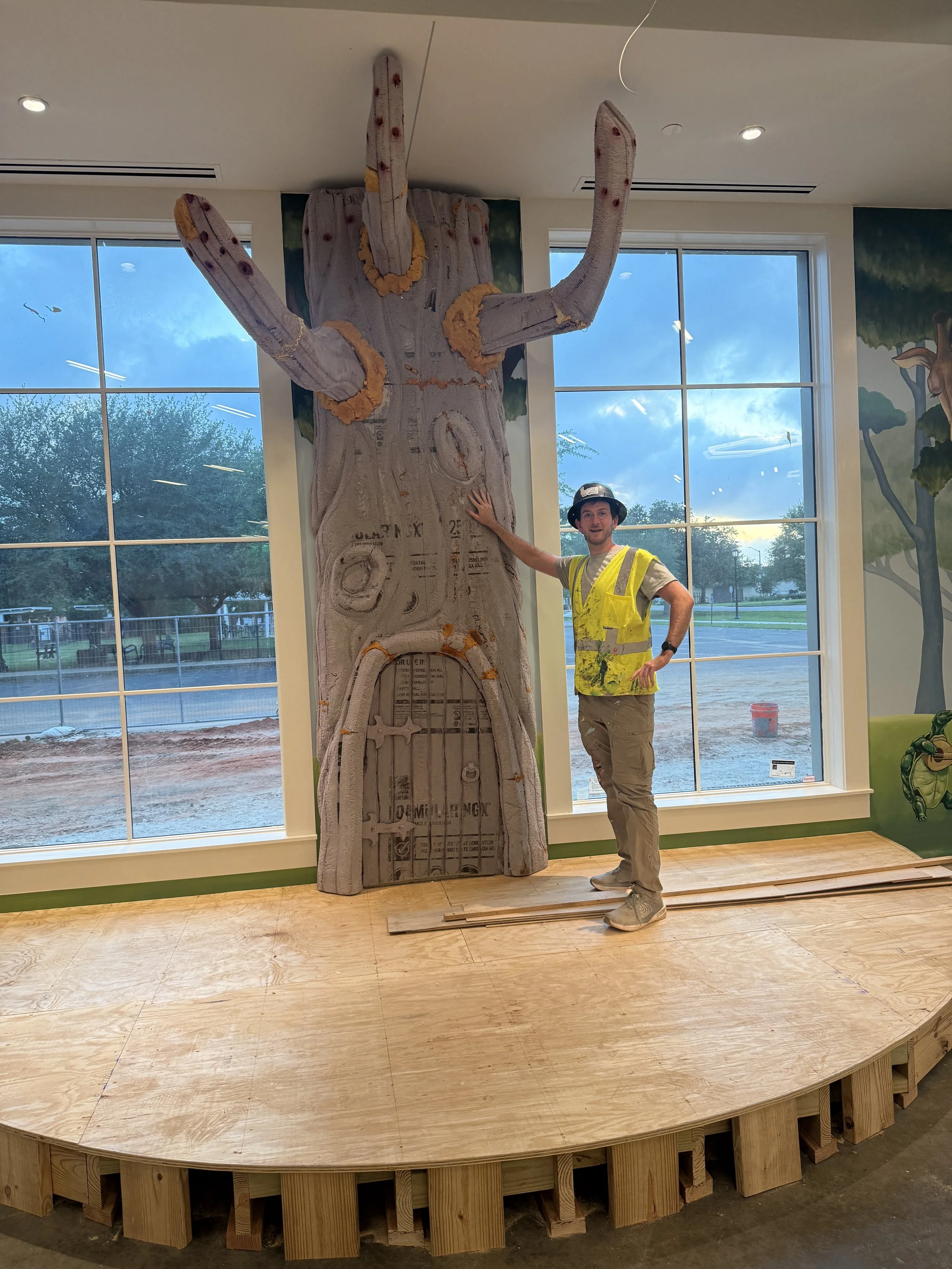 Banks Compton fabricating the large reading tree sculpture for the children's section of Foley Community Library.