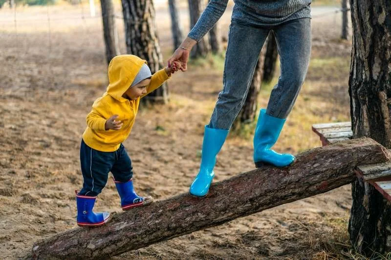 a woman and child outside