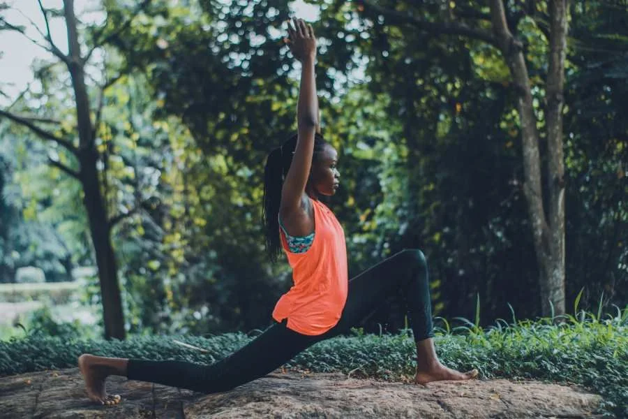 black woman doing yoga and aware of her body