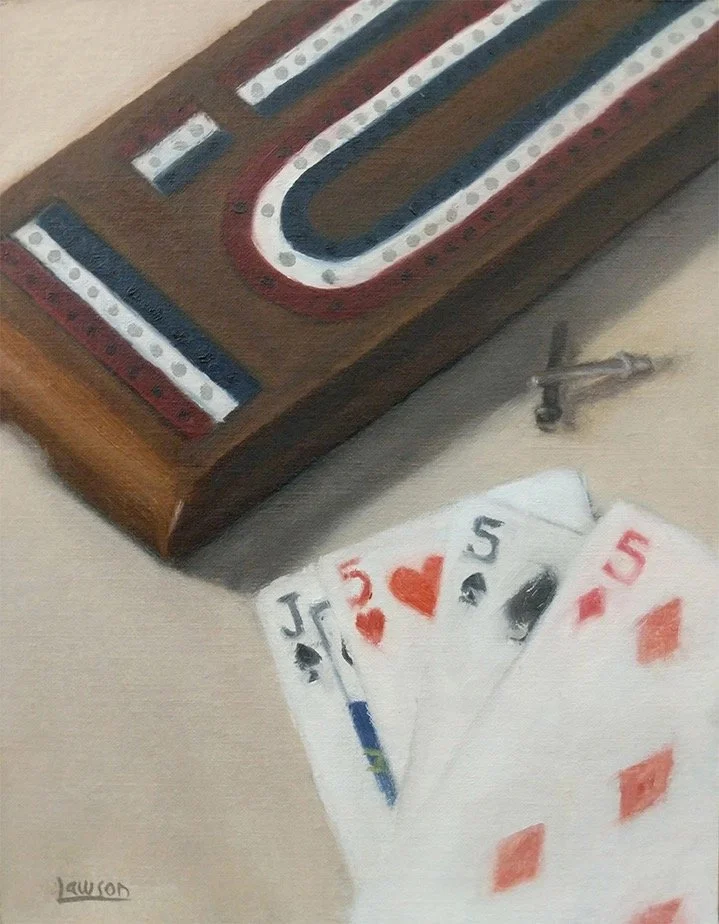 Cribbage board with playing cards and pegs