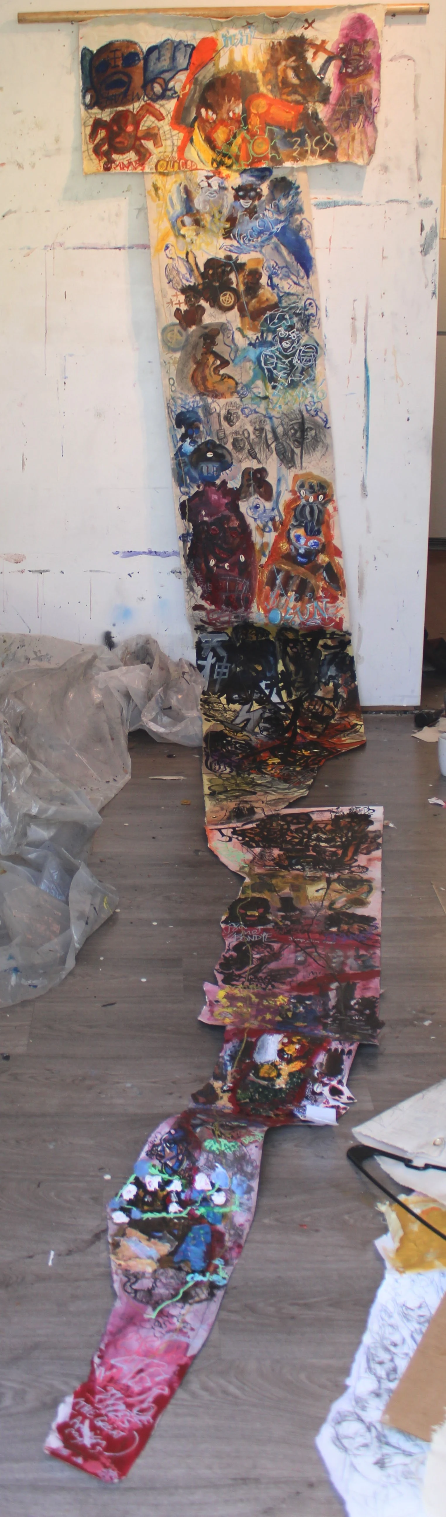 Orisha and Kami genealogy, Acrylic, graphite pencil, fabric, cards, cowrie shells, ink, oil pastel, markers, and carbon tracing on Canvas and misc. papers attached to wooden dowel, 48 x 154 inches, 2026.