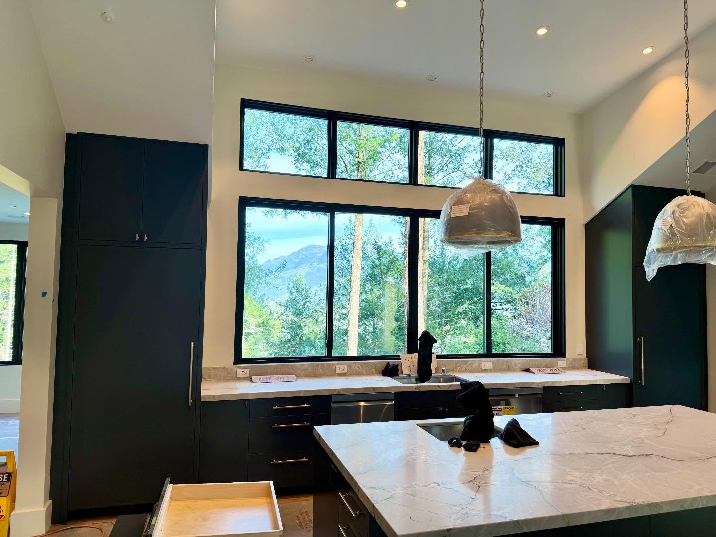 Almost move in time when the film comes off the windows. Look at that view! 

#calistoga 
#interiors 
#interiordesign 
#winecountry 
#remodel 
#newbuild 
#luxe 
#blackcabinets 
#kitchen 
#vaulted