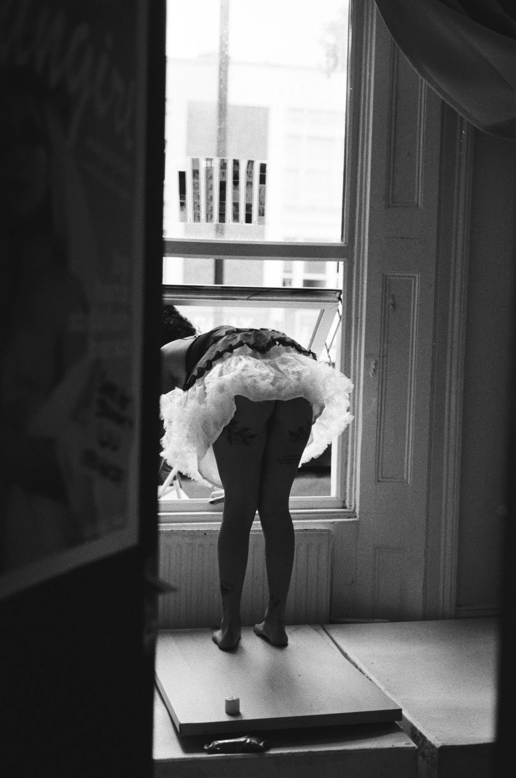 Hana with her negatives on the window 