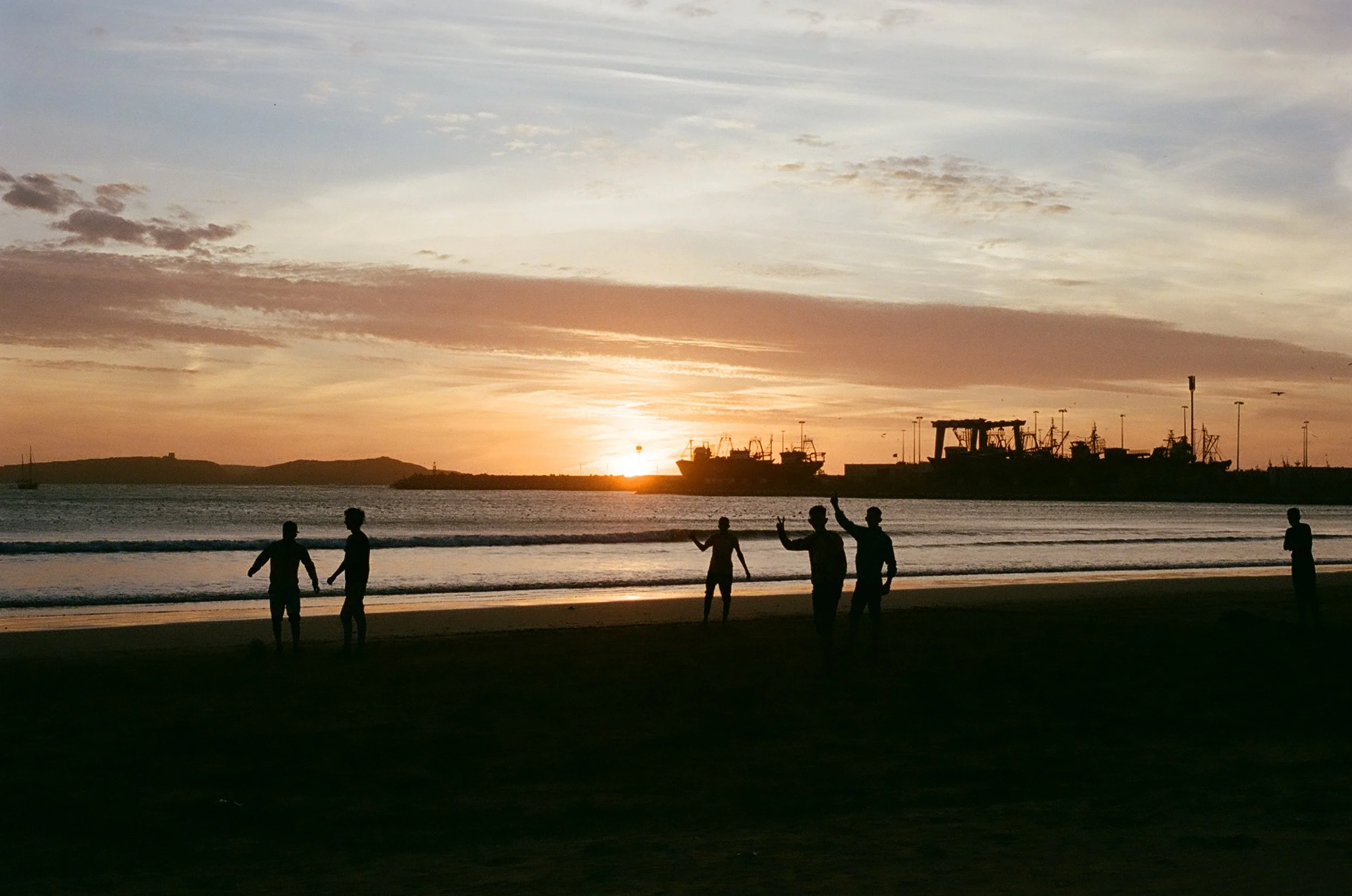 We take the dogs for a walk along the beach and the boys playing soccer wave to us. It's one of the most beautiful sunsets I've ever seen and the pictures don't do it any justice at all. 