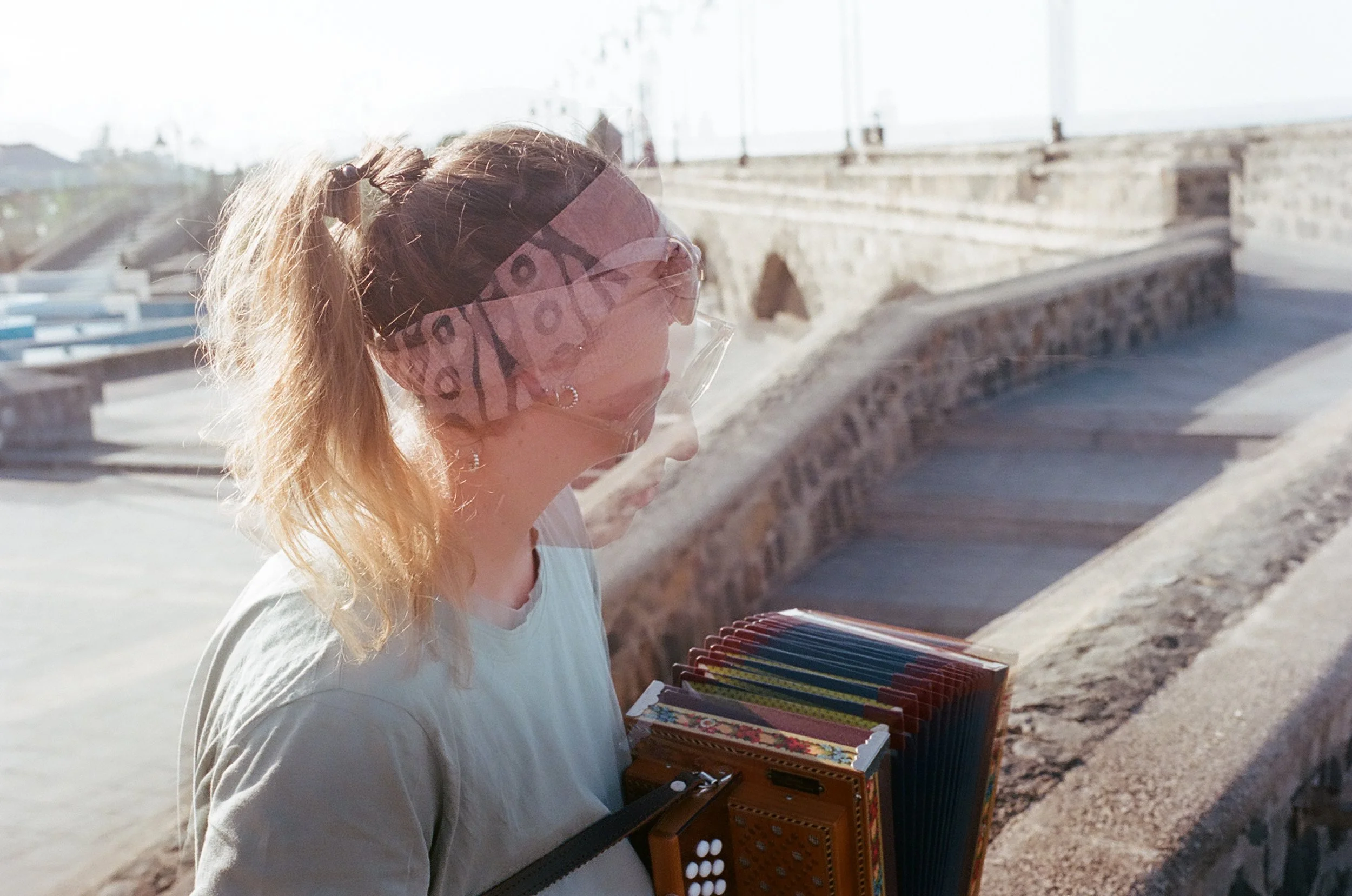 Salome busking for the first time with her Swiss Harmonica. This was when my camera was acting funny (I learned later it was because I bought bad batteries). Tenerife, Spain. 