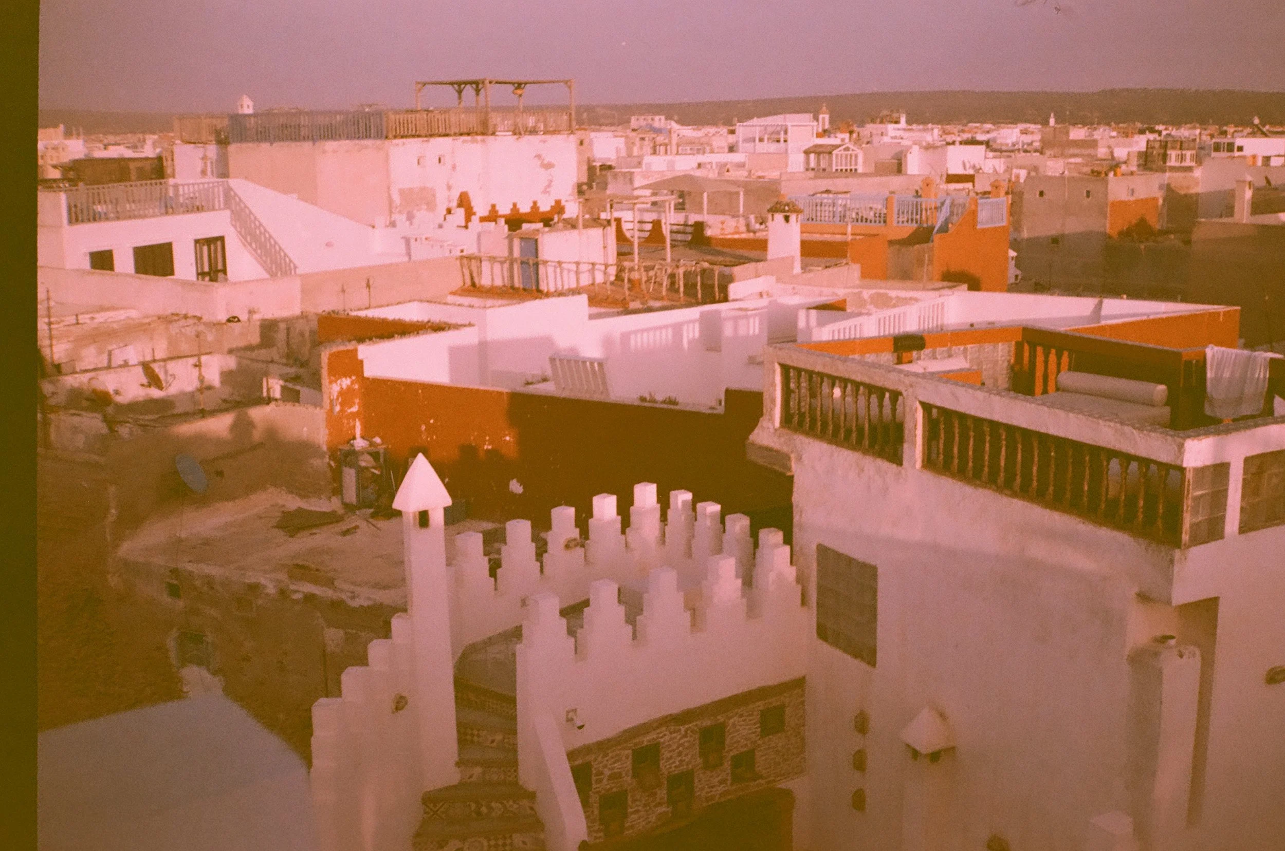 the sun as it sets across the Esso rooftops