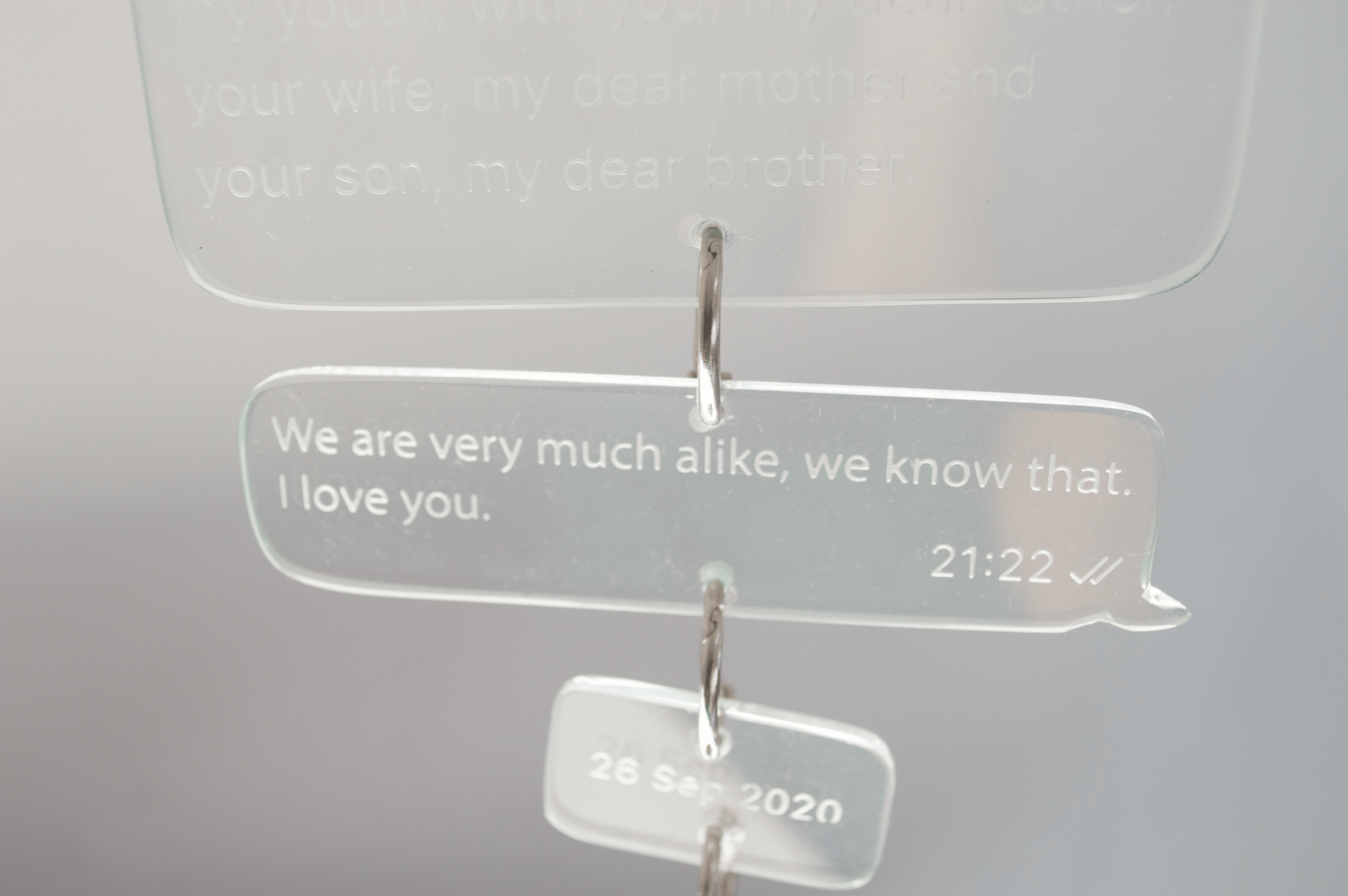 Repeat, 2026
Repeat is a wall-mounted sculpture by Severin Hallauer combining steel, engraved glass, and ceramic. Through a personal letter to the artist's father and the symbolism of an apple hanging from a branch, the work reflects on inherited tra