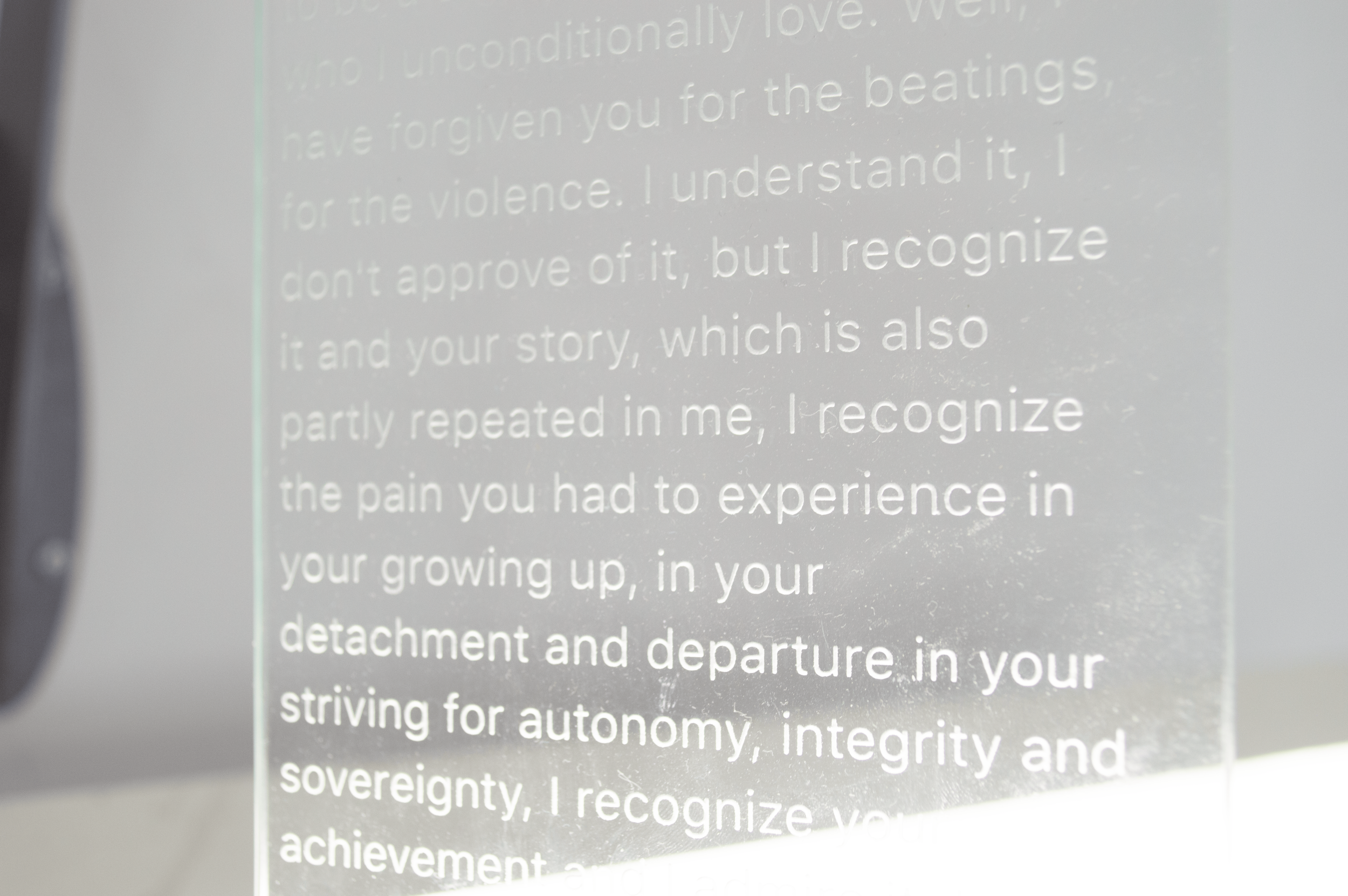 Severin Hallauer, Repeat, 2026. Wall-mounted sculpture in steel, engraved glass, and ceramic exploring family memory, inheritance, and intergenerational trauma.