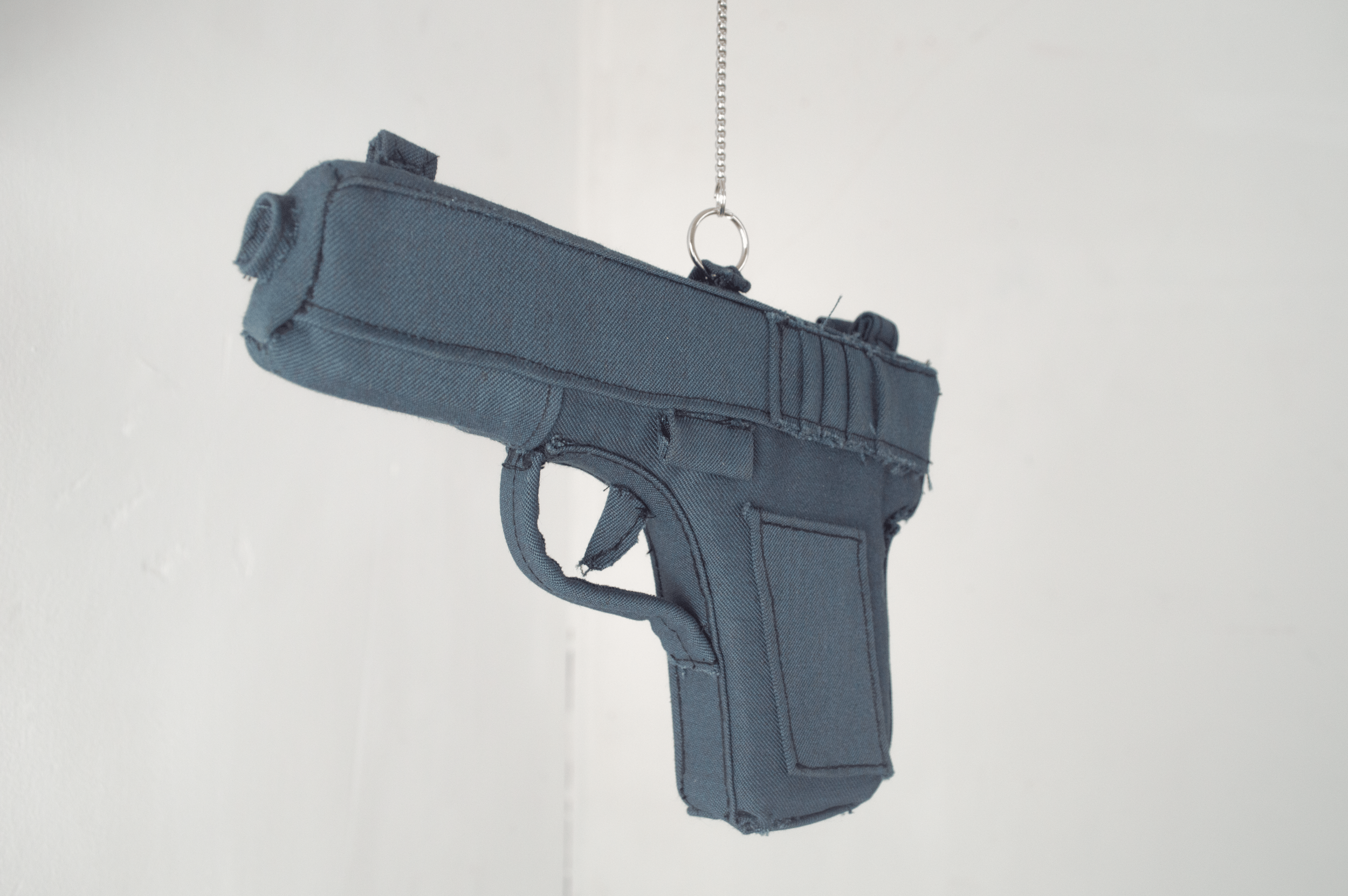 Repeat, Repeat, 2026
In Repeat, Repeat, Severin Hallauer combines a steel branch, a fabric pistol made from a vintage Basel police uniform, and a cast aluminum police badge. The sculpture explores inherited violence, family history, and the fragile b