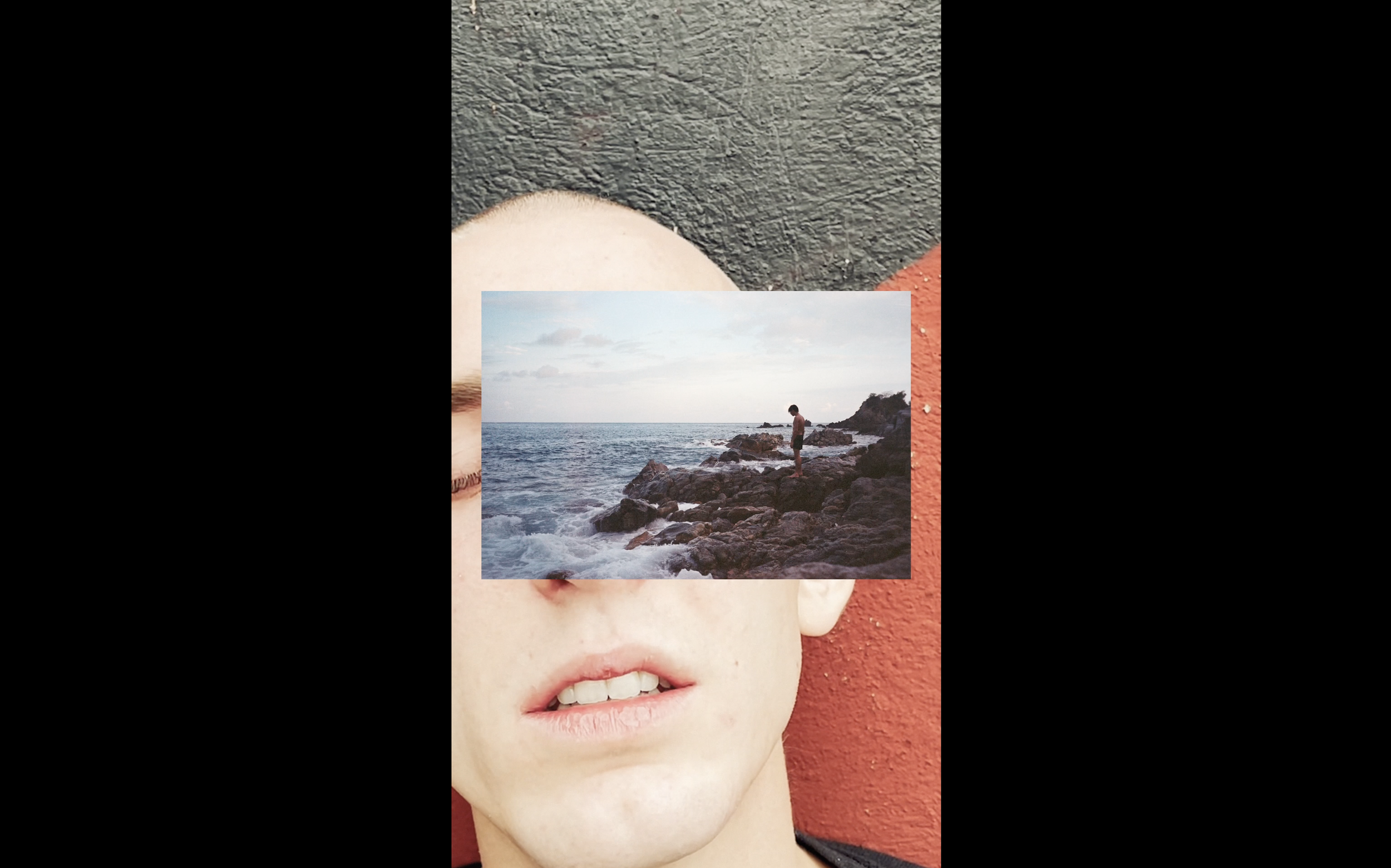 art video by swiss artist SEVERIN HALLAUER - consisting  of analog photographs and videos. Close-up of a person's face with a beach scene overlaid on the eyes, showing rocks, the ocean, and a person standing on rocks by the water.