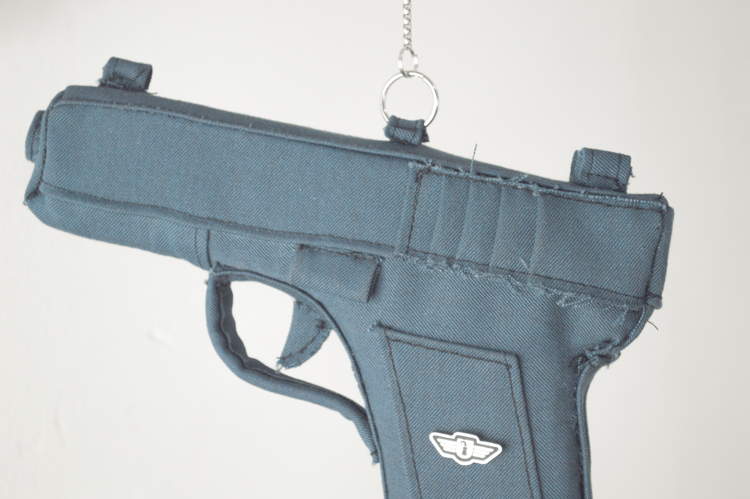 Repeat, Repeat, 2026
In Repeat, Repeat, Severin Hallauer combines a steel branch, a fabric pistol made from a vintage Basel police uniform, and a cast aluminum police badge. The sculpture explores inherited violence, family history, and the fragile b