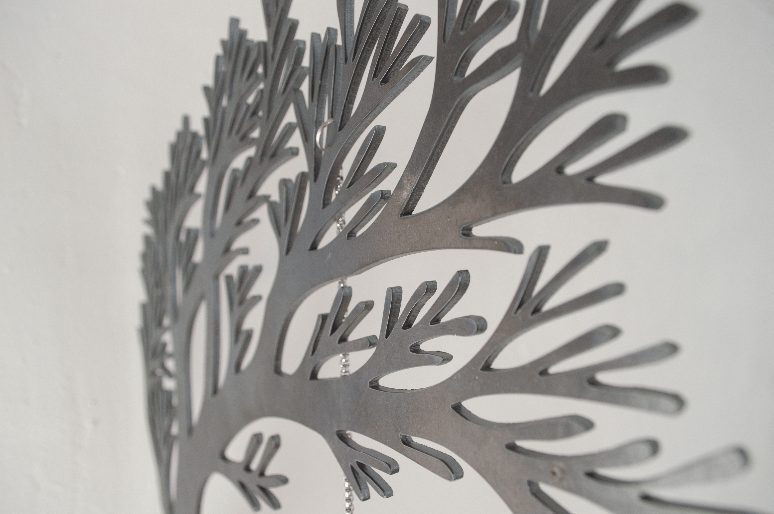 Repeat, 2026
Repeat is a wall-mounted sculpture by Severin Hallauer combining steel, engraved glass, and ceramic. Through a personal letter to the artist's father and the symbolism of an apple hanging from a branch, the work reflects on inherited tra