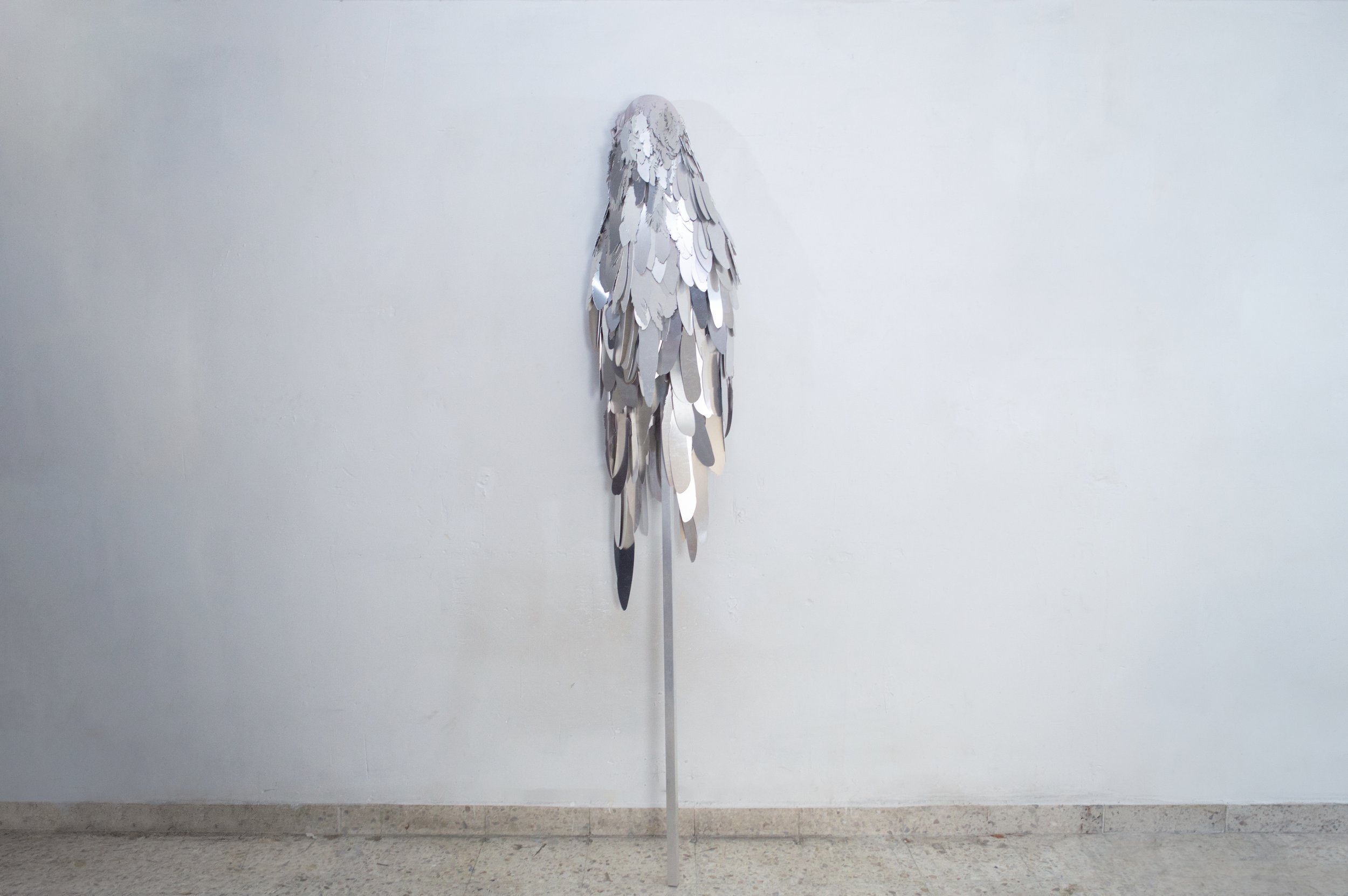 Severin Hallauer, Armour (Leftovers of Salvation), life-sized sculpture composed of aluminium feathers inspired by grey heron plumage. Contemporary sculpture exploring protection, migration, vulnerability, and the promise of escape.