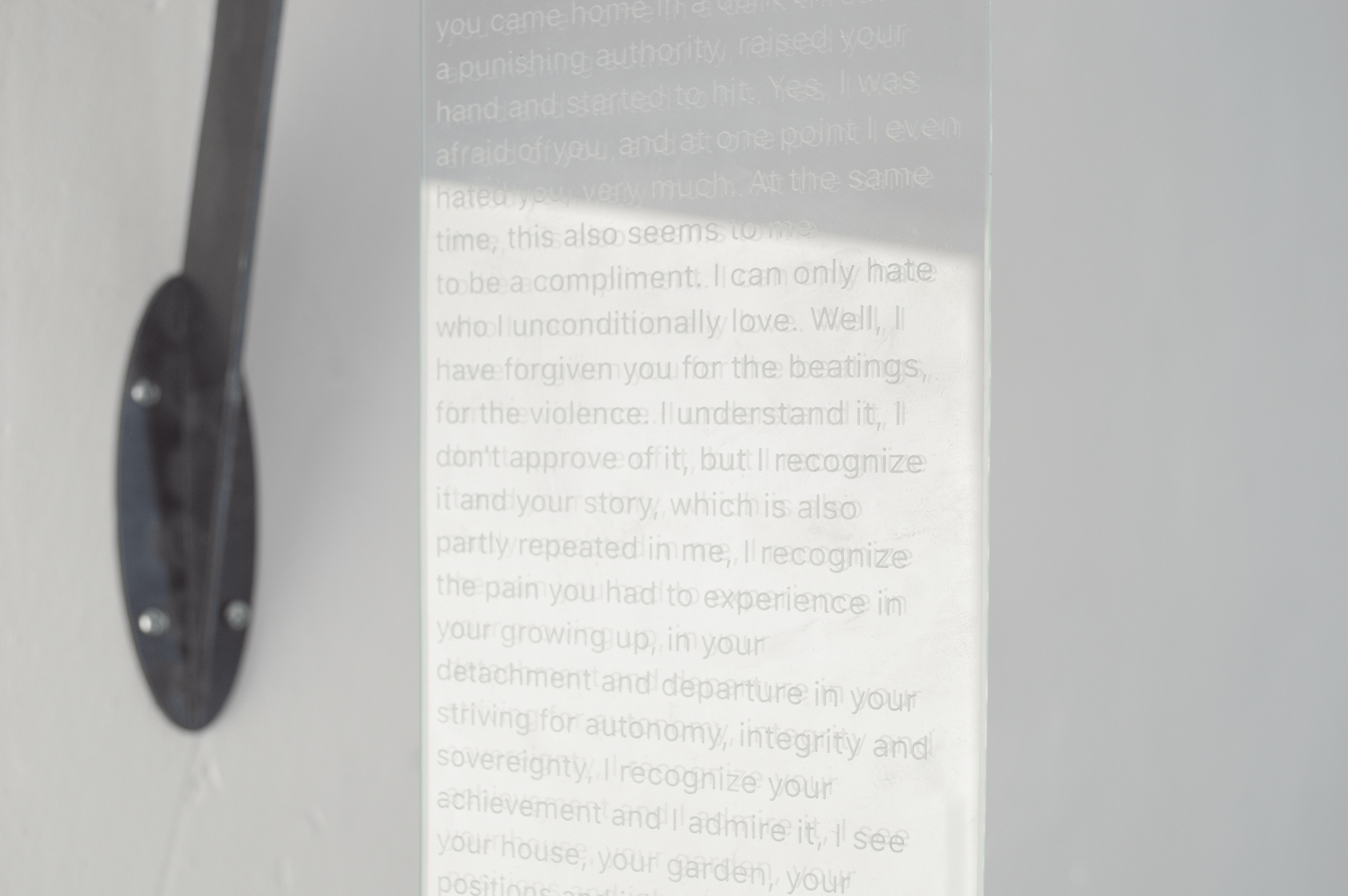 Severin Hallauer, Repeat, 2026. Wall-mounted sculpture in steel, engraved glass, and ceramic exploring family memory, inheritance, and intergenerational trauma.