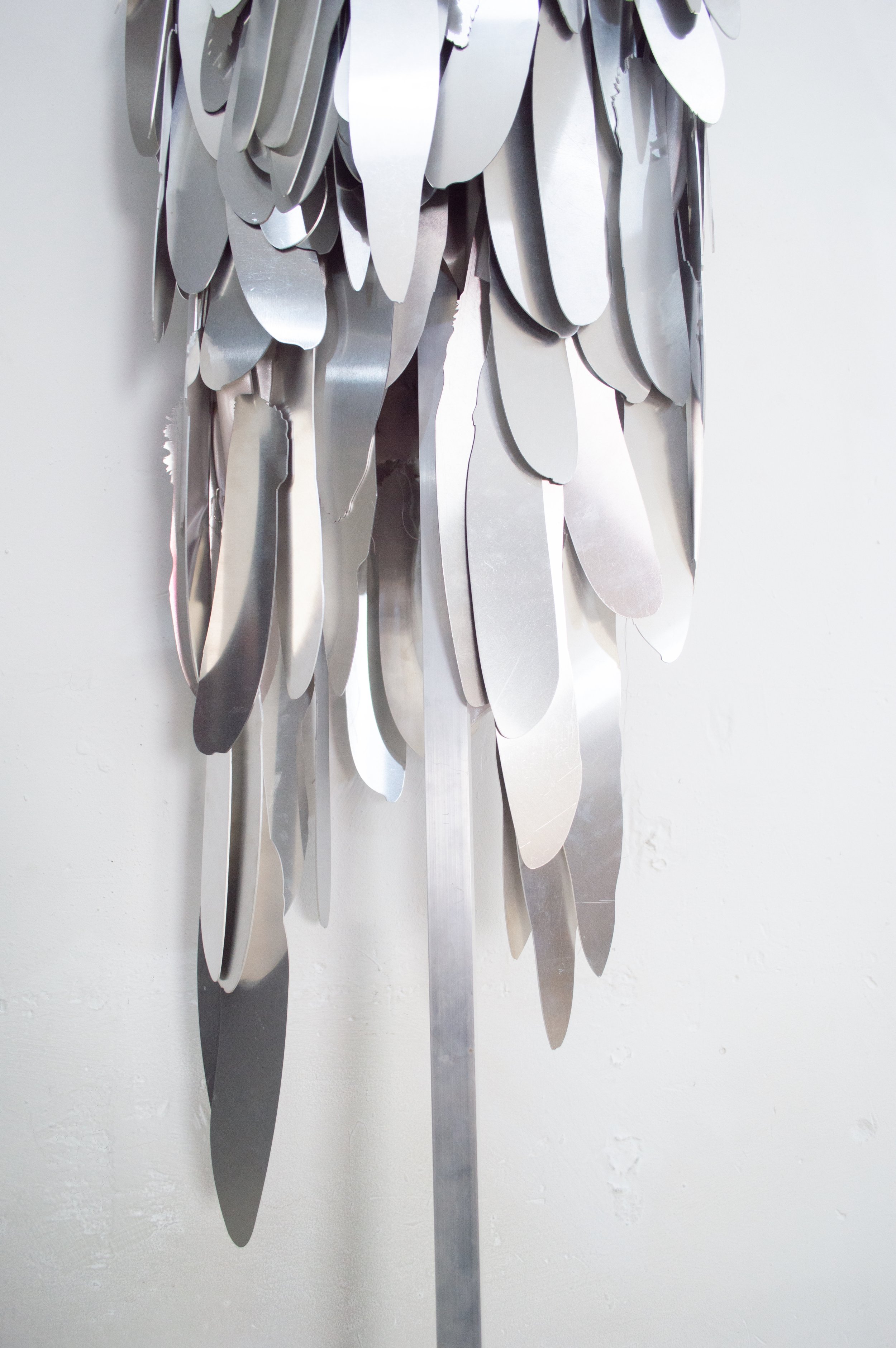 Severin Hallauer, Armour (Leftovers of Salvation), life-sized sculpture composed of aluminium feathers inspired by grey heron plumage. Contemporary sculpture exploring protection, migration, vulnerability, and the promise of escape.