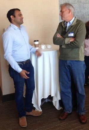 Deepak Dugar (Cohort 2015) and Tom Boussie (l to r) chat during an event.