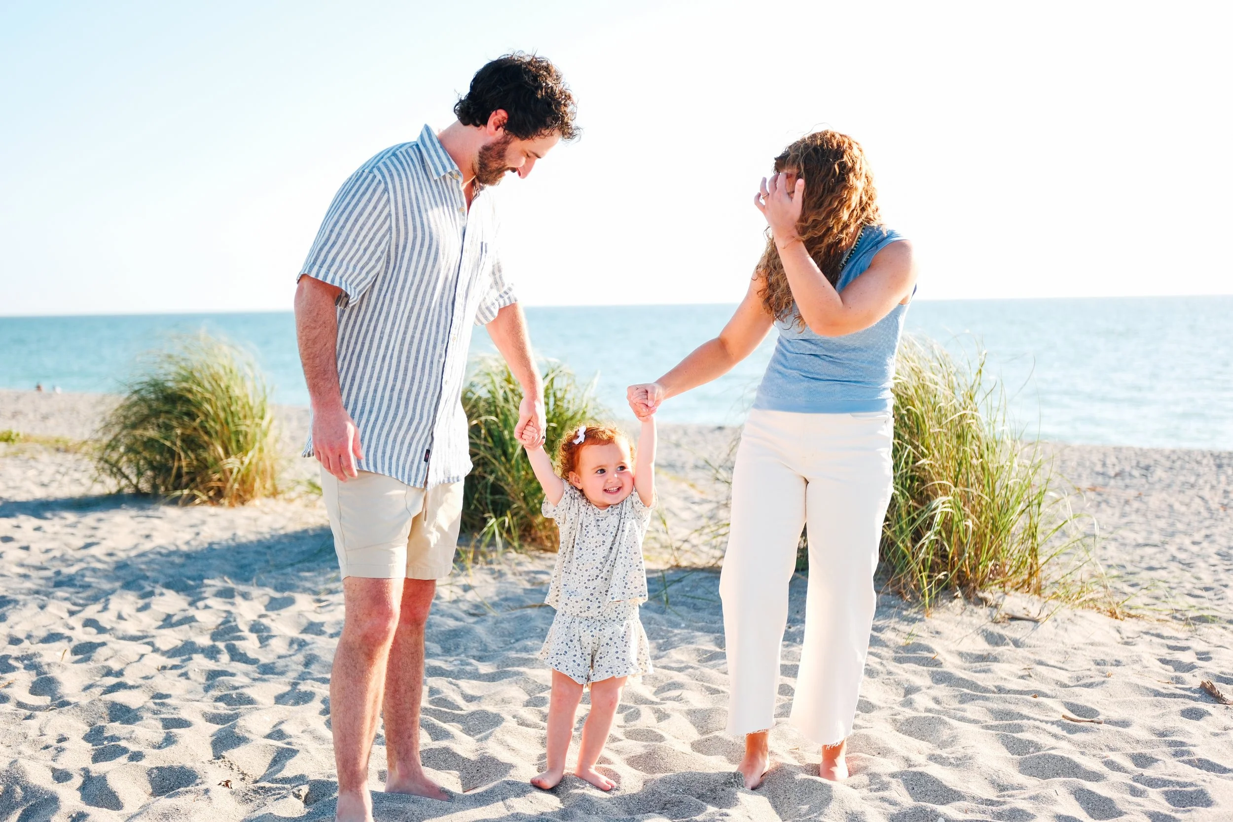 family-beach-photoshoot-venice-florida-walking-swinging-toddler3.jpg