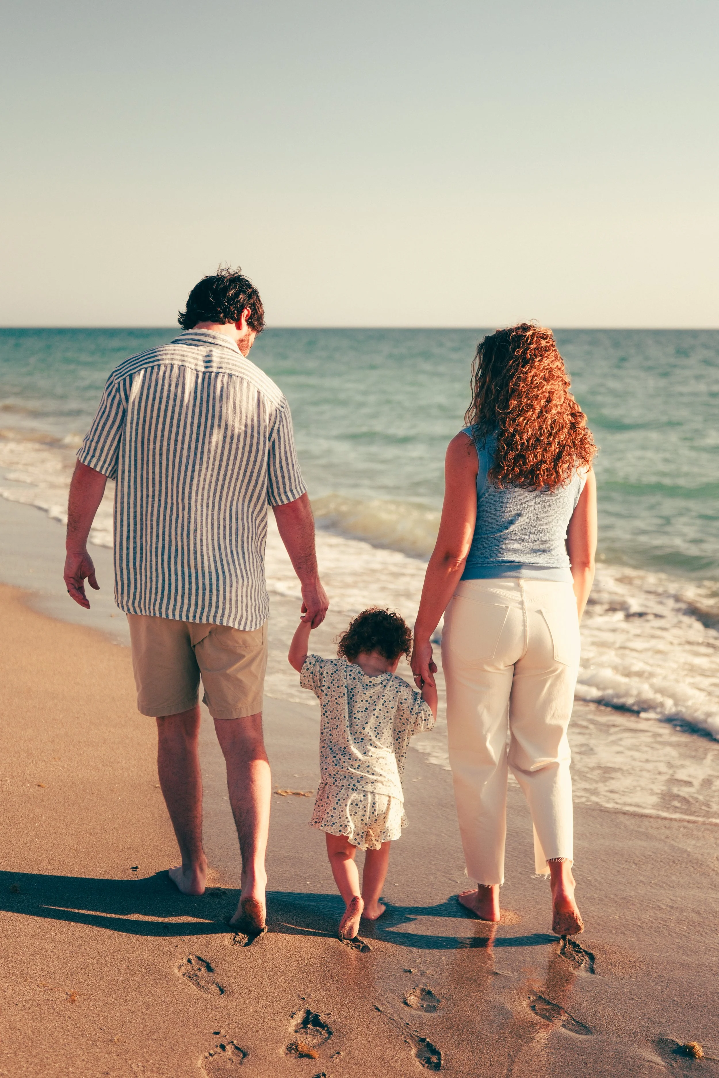family-beach-photoshoot-venice-florida-walking-along-the-water-filmic.jpg