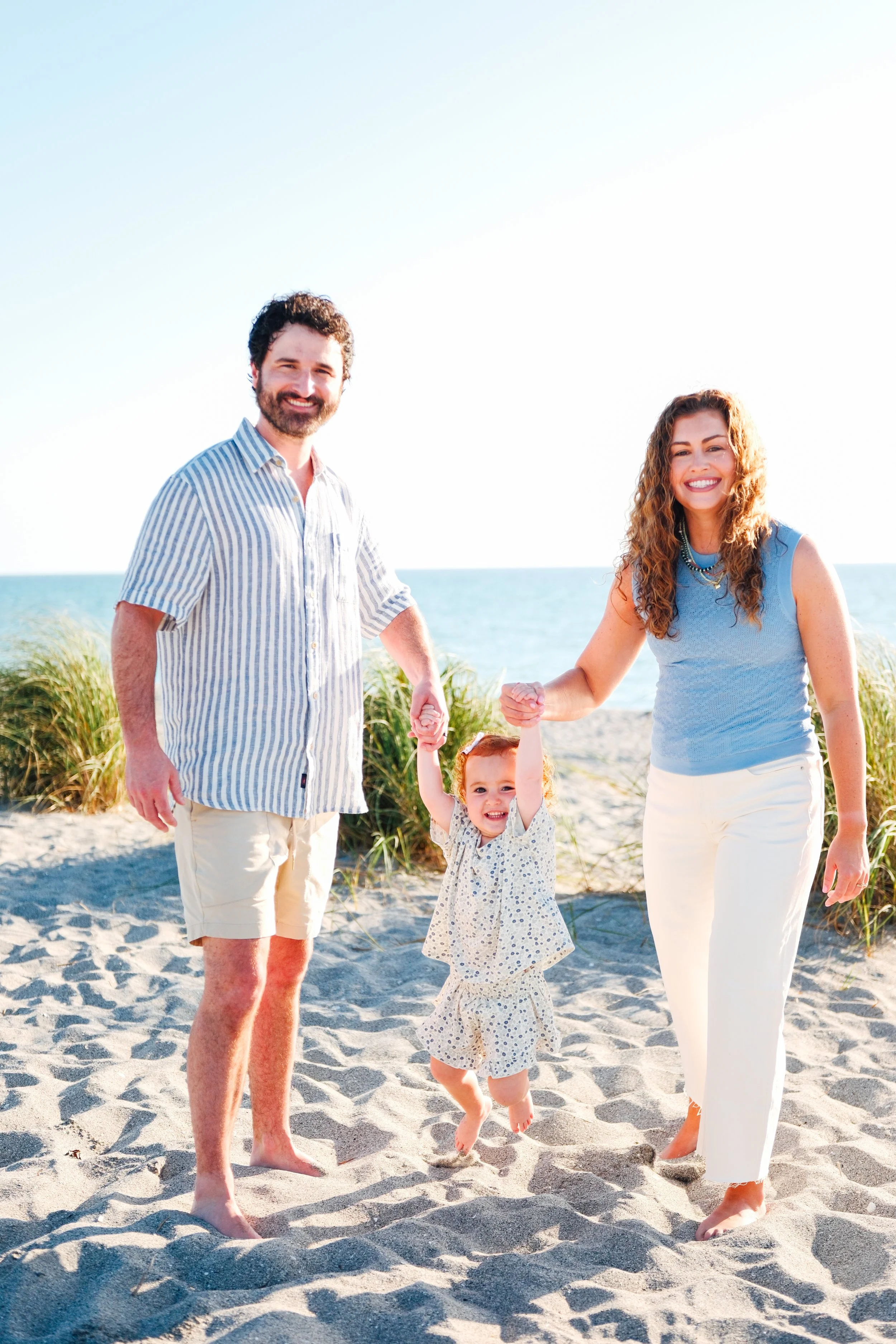 family-beach-photoshoot-venice-florida-walking-swinging-toddler4.jpg