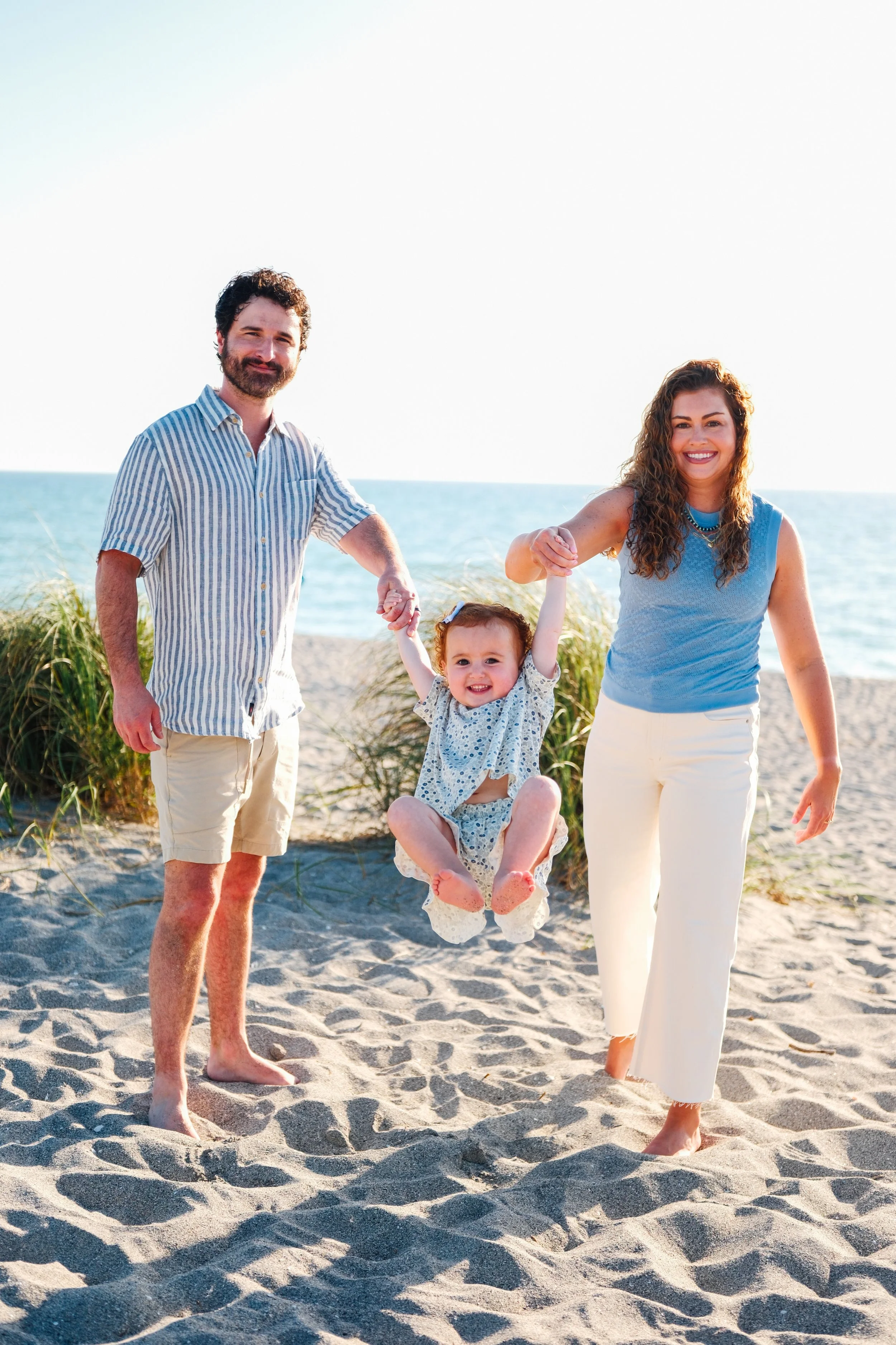 family-beach-photoshoot-venice-florida-swinging.jpg