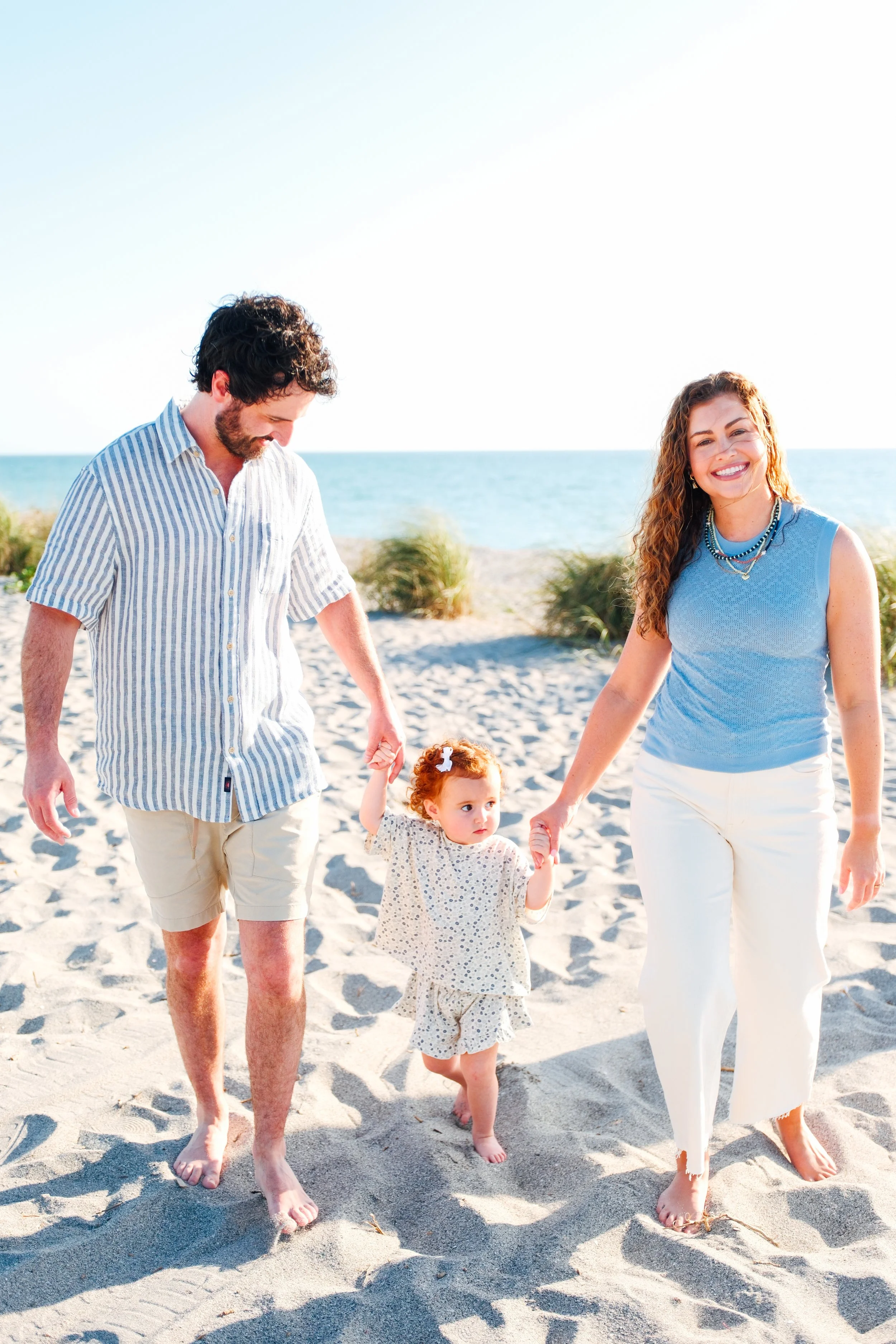 family-beach-photoshoot-venice-florida-walking-holding-toddler2.jpg