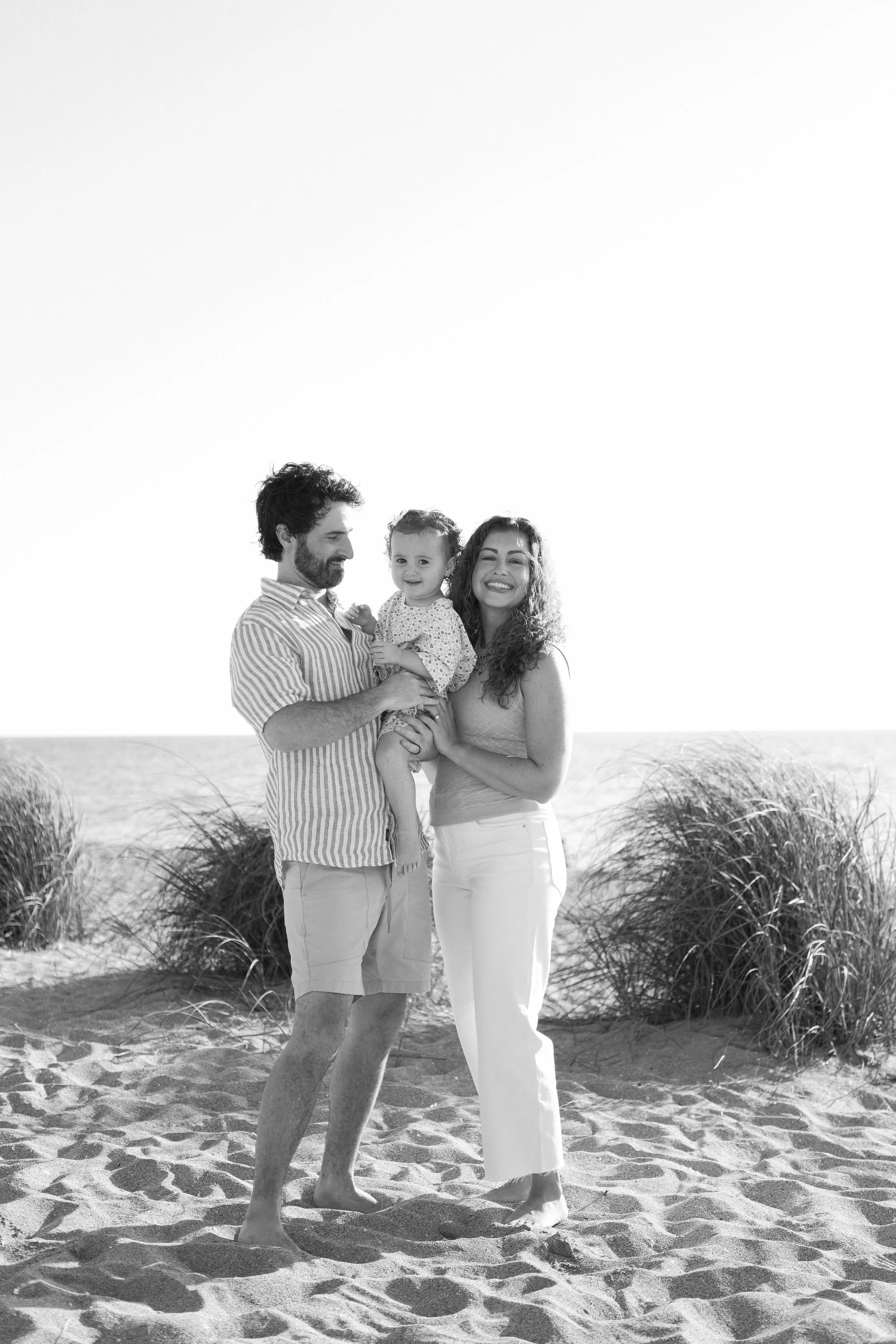 family-beach-photoshoot-venice-florida-standing-black-and-white.jpg