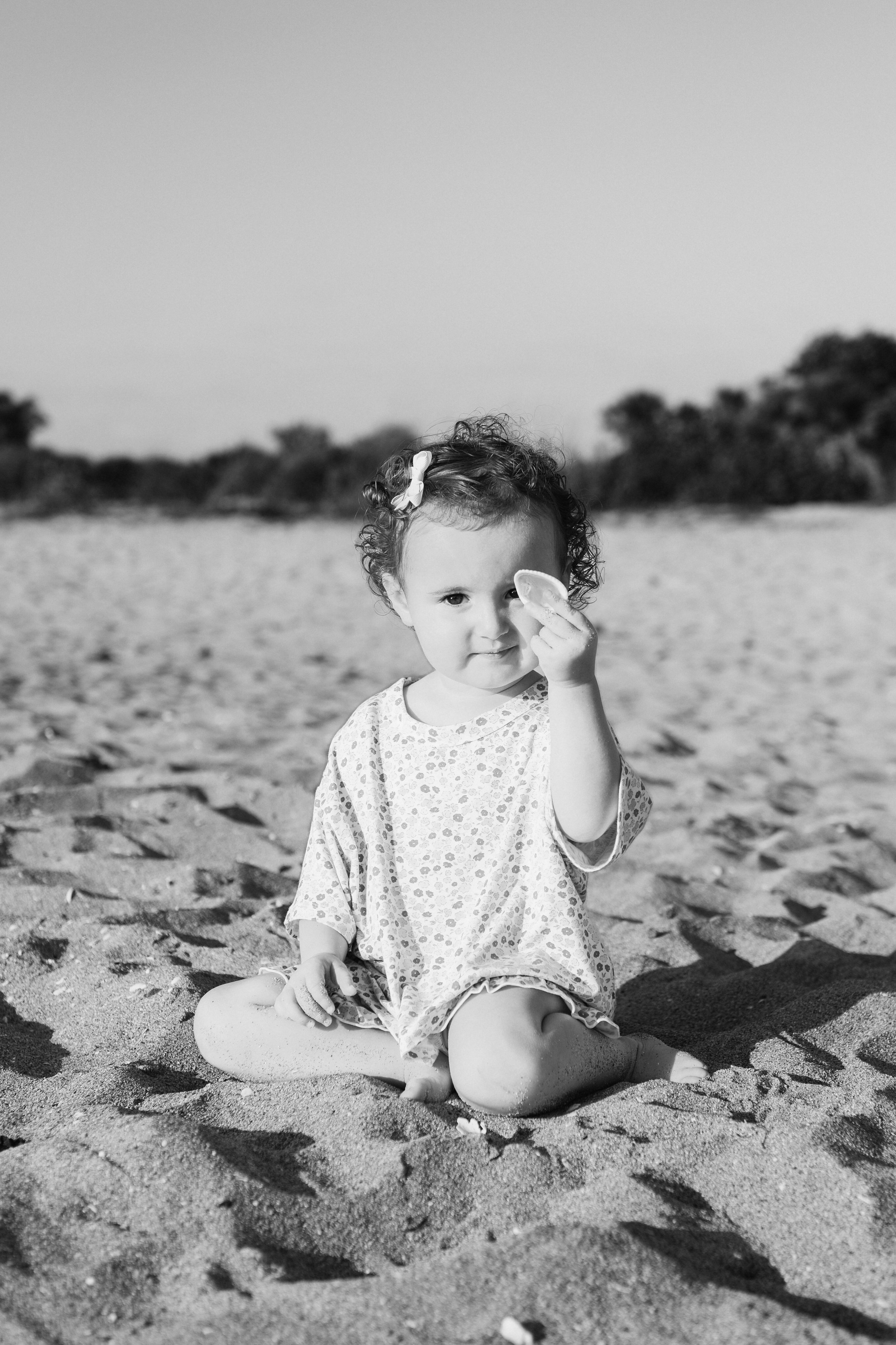toddler-beach-portrait-venice-florida-shell-black-and-white.jpg