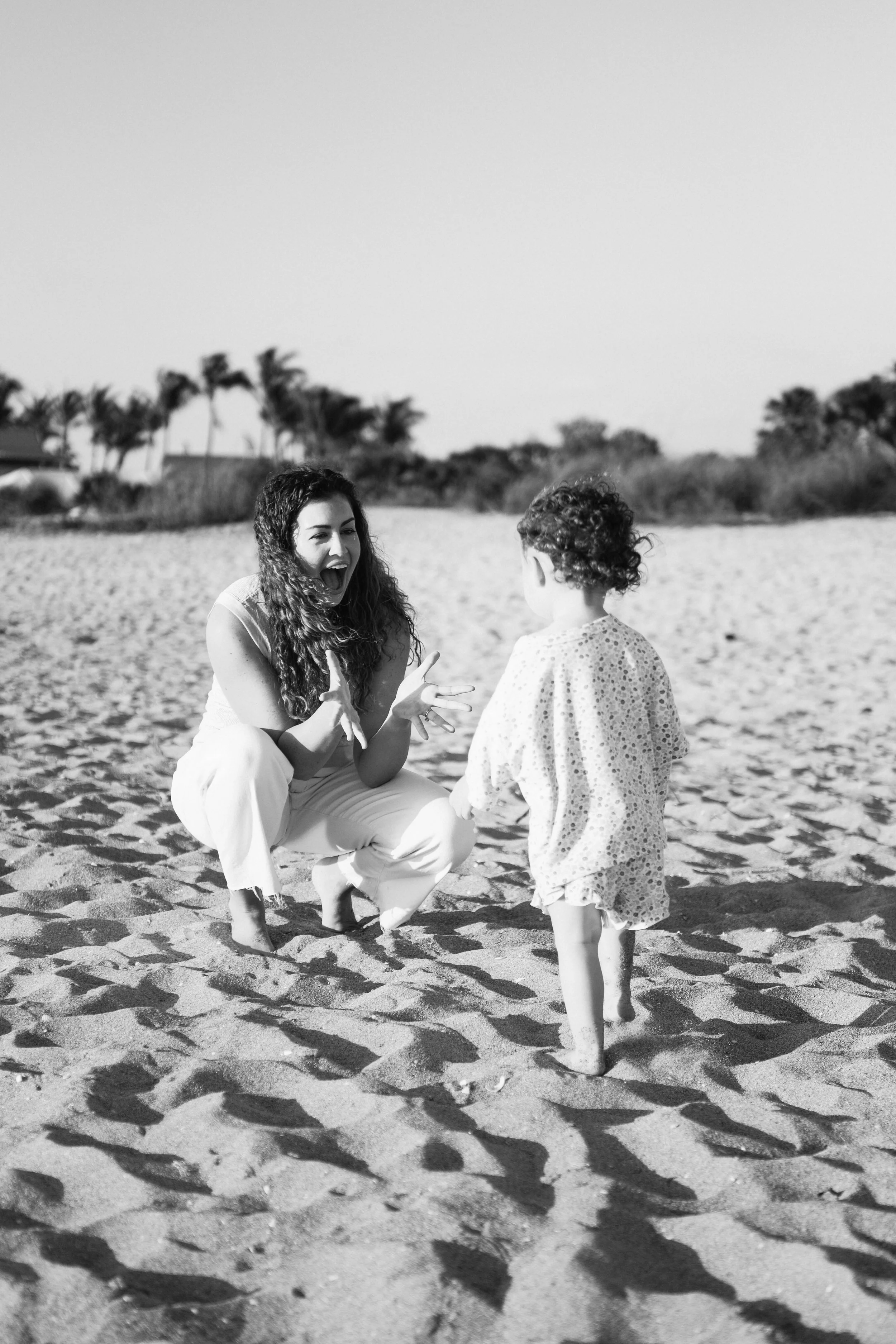 mother-daughter-beach-session-venice-florida-sand-portrait-walking-black-and-white.jpg