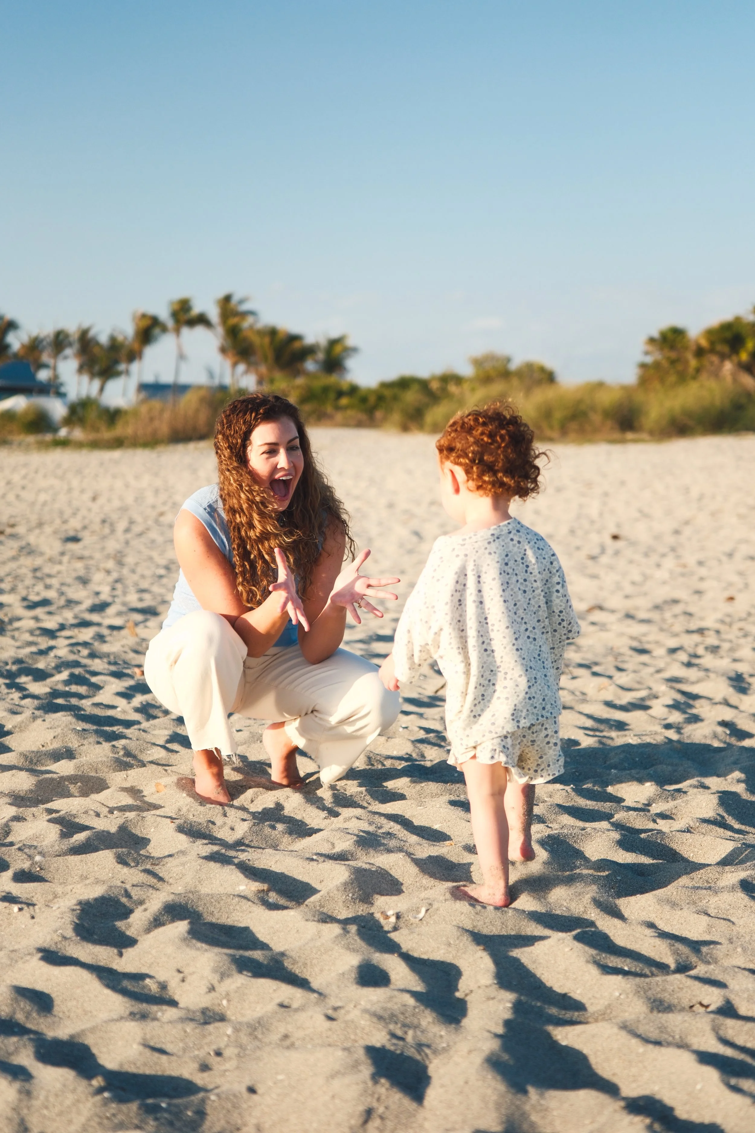 mother-daughter-beach-session-venice-florida-sand-portrait-walking-film-color.jpg