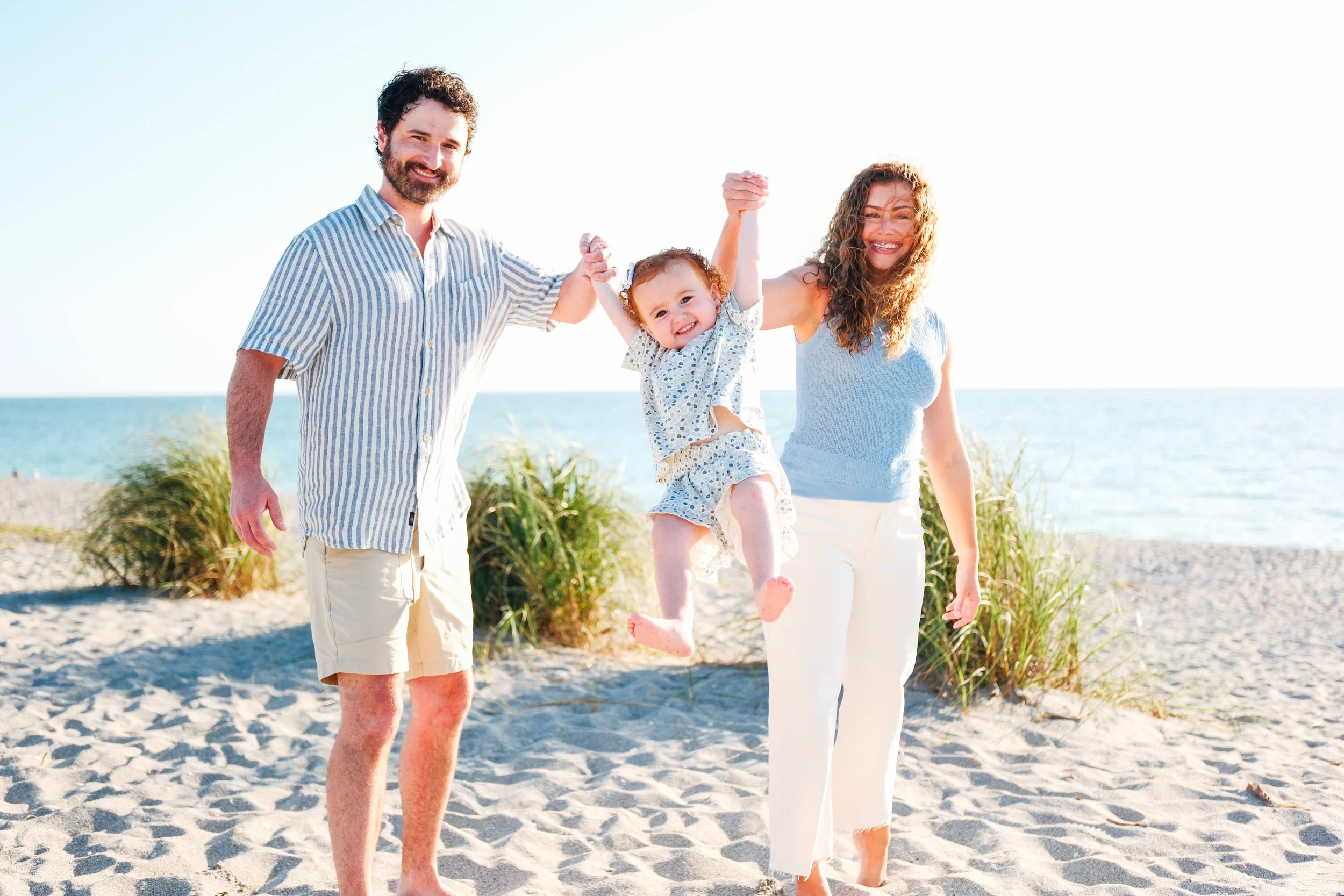 family-beach-photoshoot-venice-florida-walking-swinging-toddler2.jpg