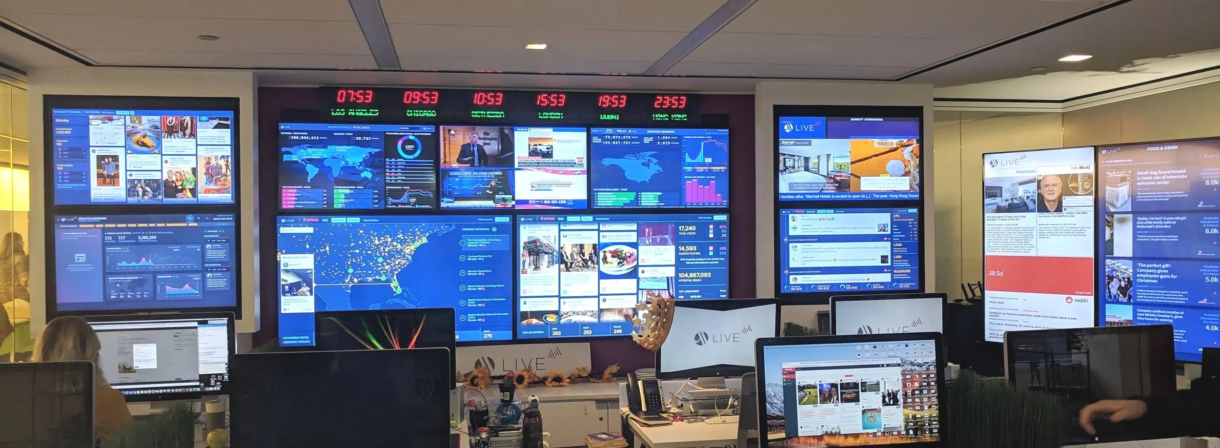 The M Live command center at the former headquarters of Marriott International, which is a glass enclosed room with a wall full of screens to monitor world news and hospitality industry trends