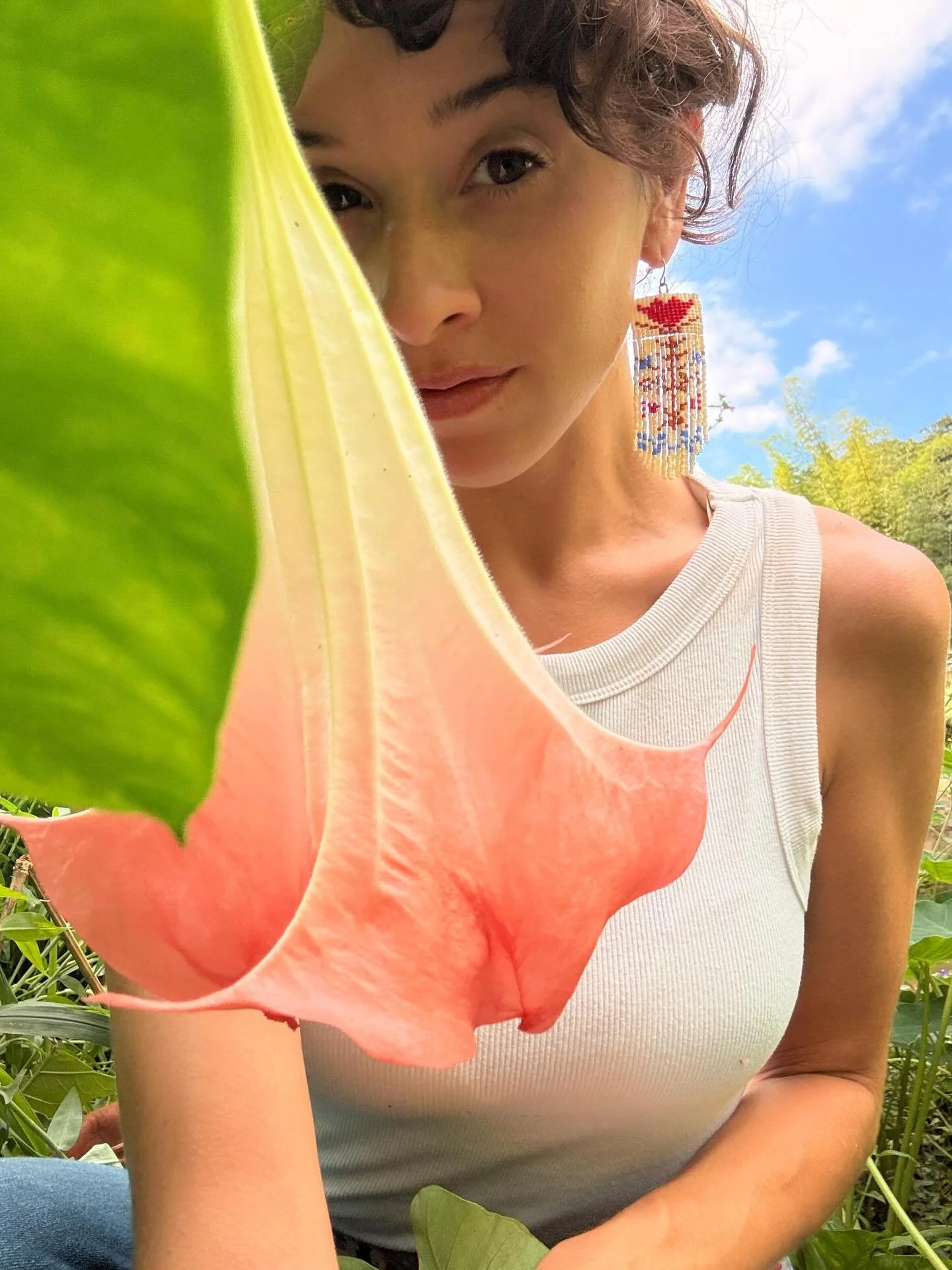 sweet flor de campana : 
I crossed a river barefoot to greet you : swaying next to achiote : you told me to reconcile with who I am, and who I am not : 

I am a poet of the mountains and moon and flowers : I am a daughter of the lands of the mitochon