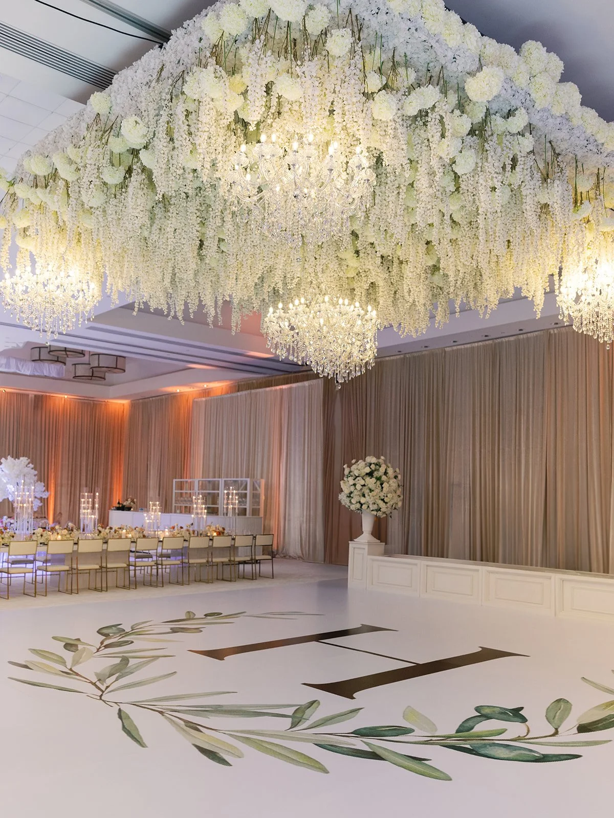 large hanging installment above the dance floor with incorporated chandeliers hysteria and hydrangeas at tic sawgrass ponte vedra