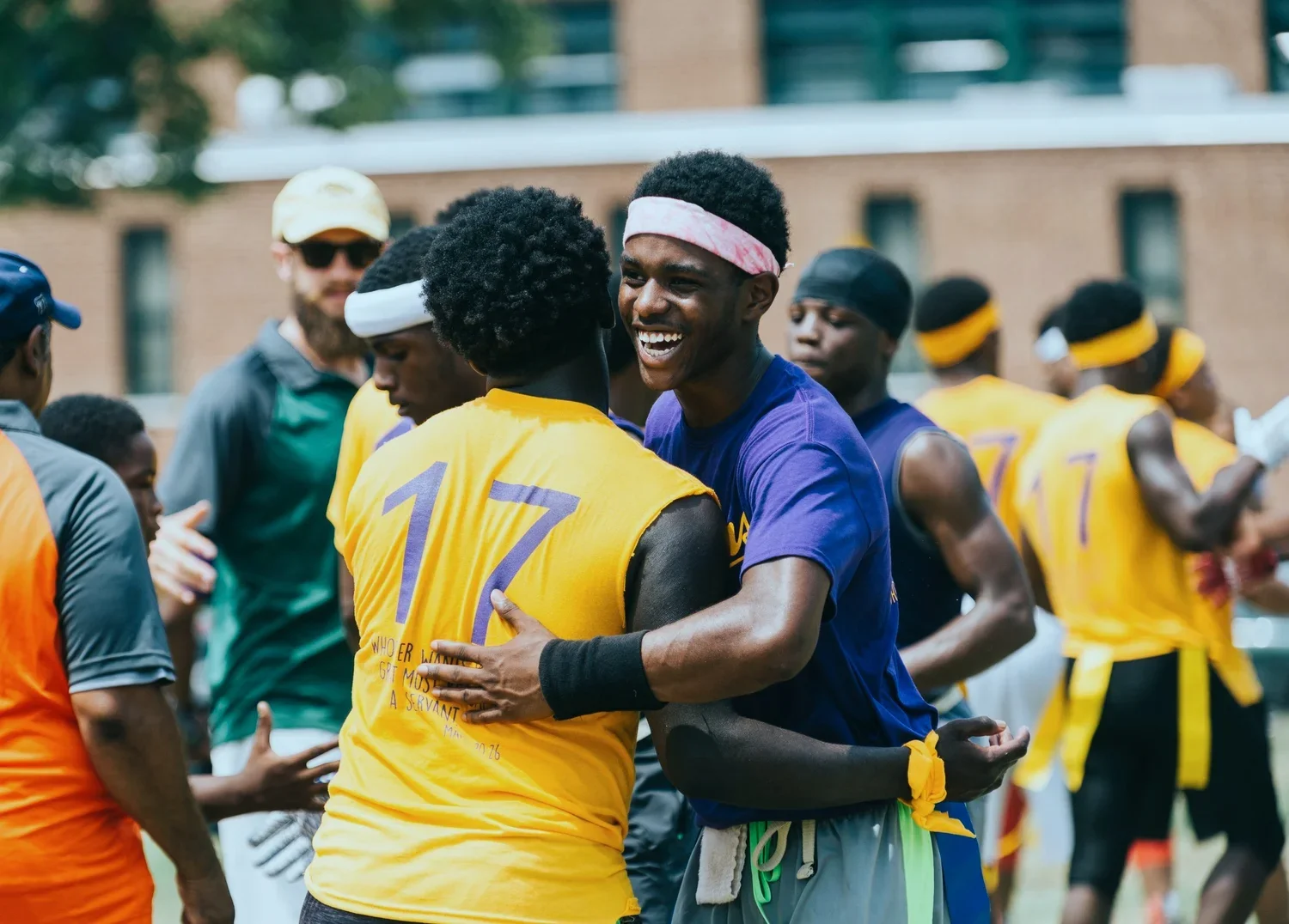 young men hugging after a sports game