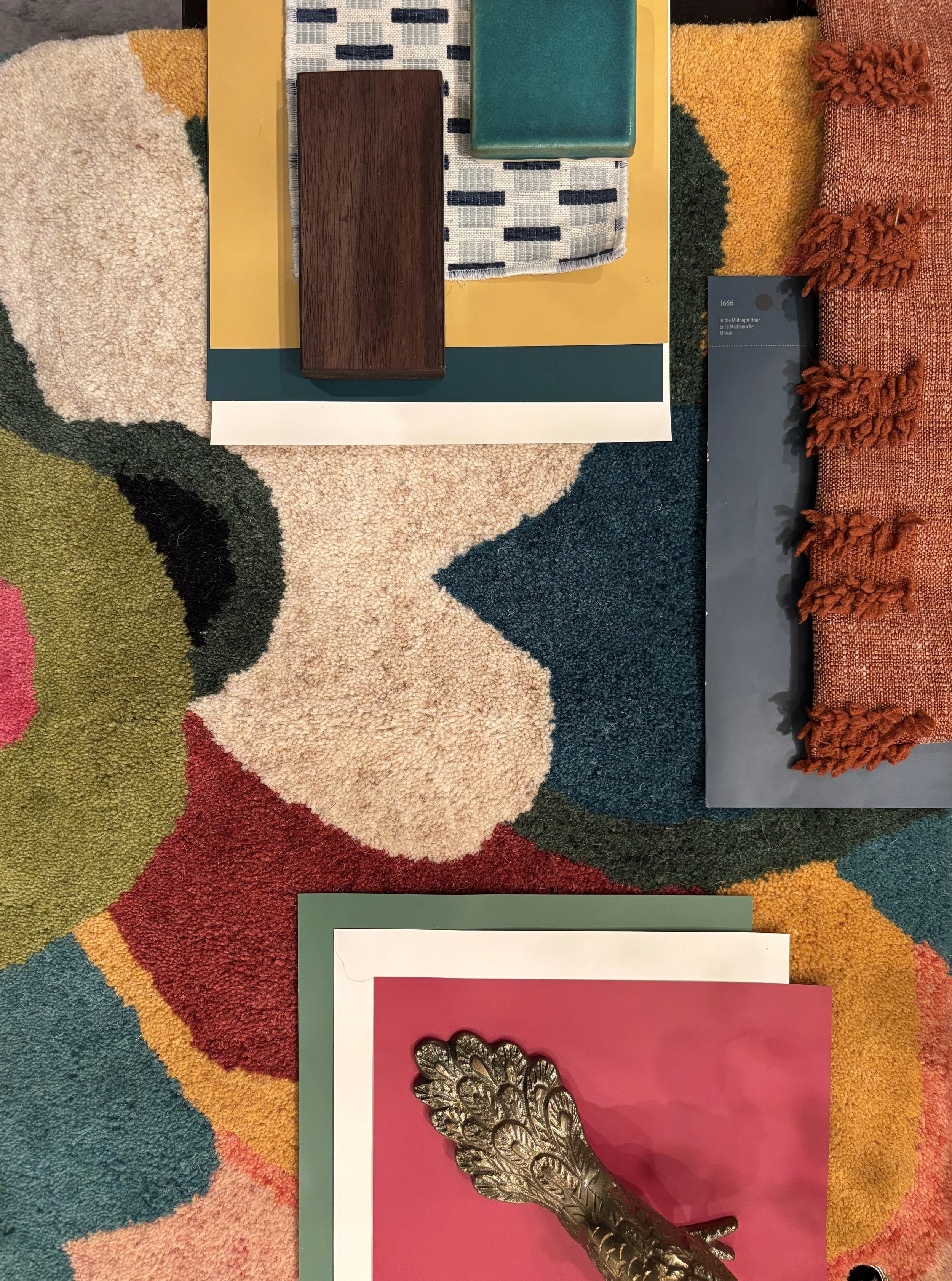 Colorful textured area rug with abstract design featuring various bold colors and shapes.