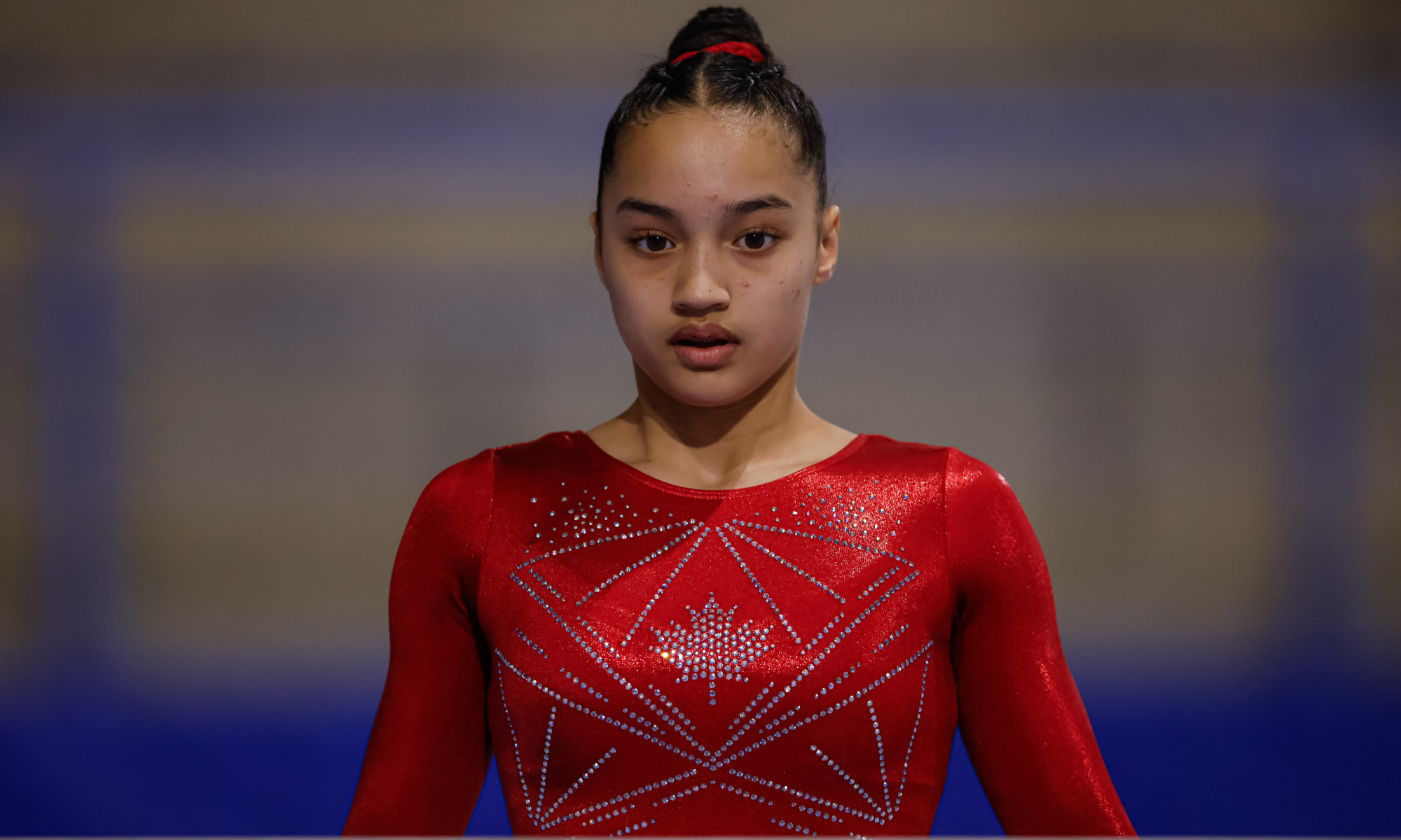 Gymnast in team canada leotard in deep focus