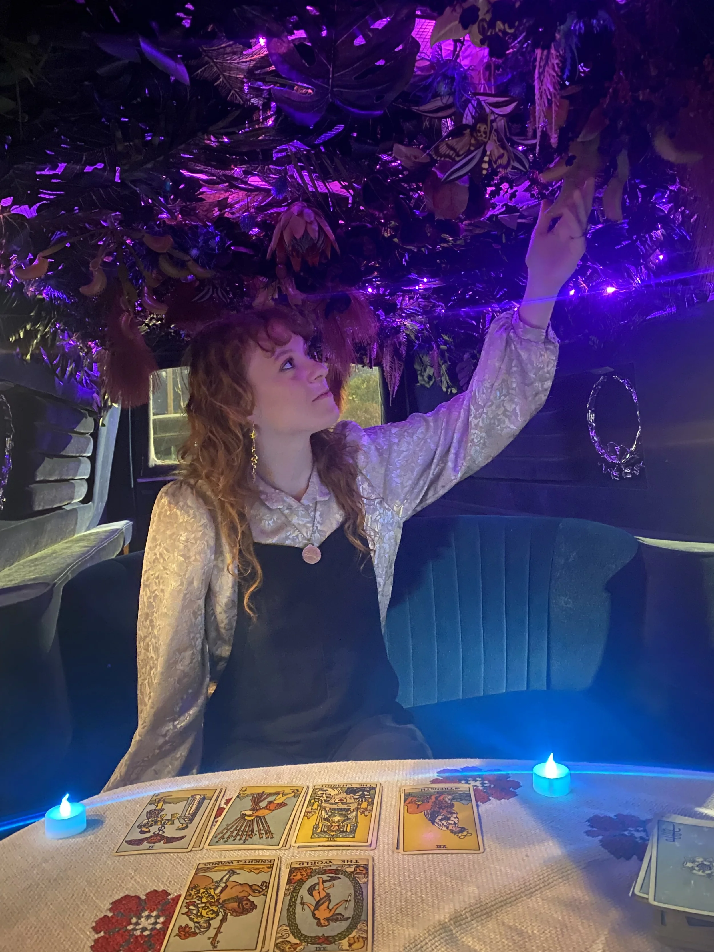 Tarot cards laid out for a private reading inside The Tarot Hearse