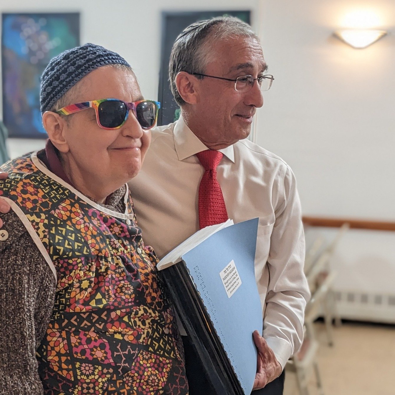 Everyone at our Seder is a guest of honor, from Eliyahu to Cynthia Groopman, Ashreynu's President. Last year she joined us for the Seder with her Braille Haggadah, which - just as a Haggadah should do - helps her participate in the Seder with singing