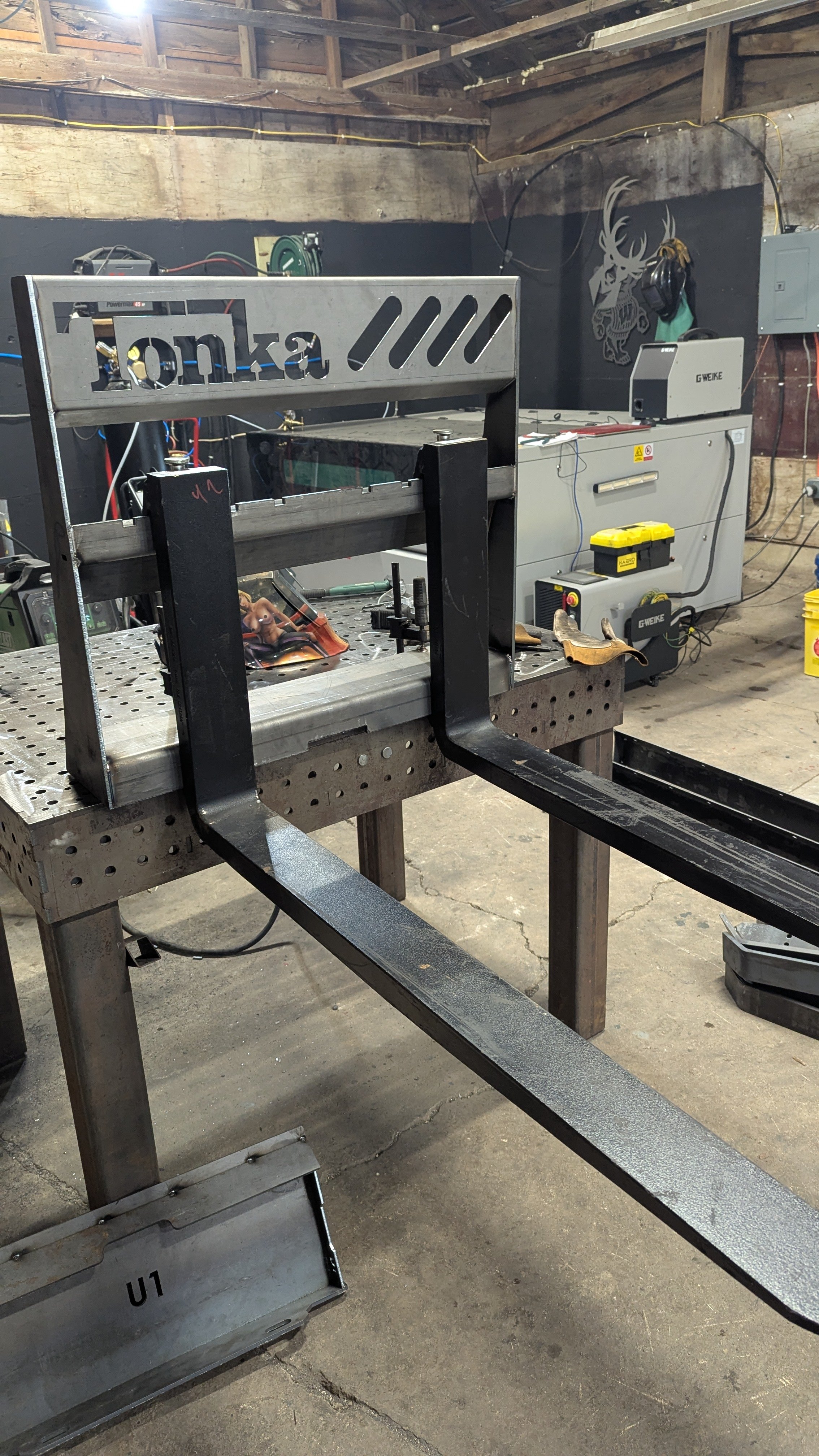 04_raw_pff_with_42in_forks_on_weld_table.jpg