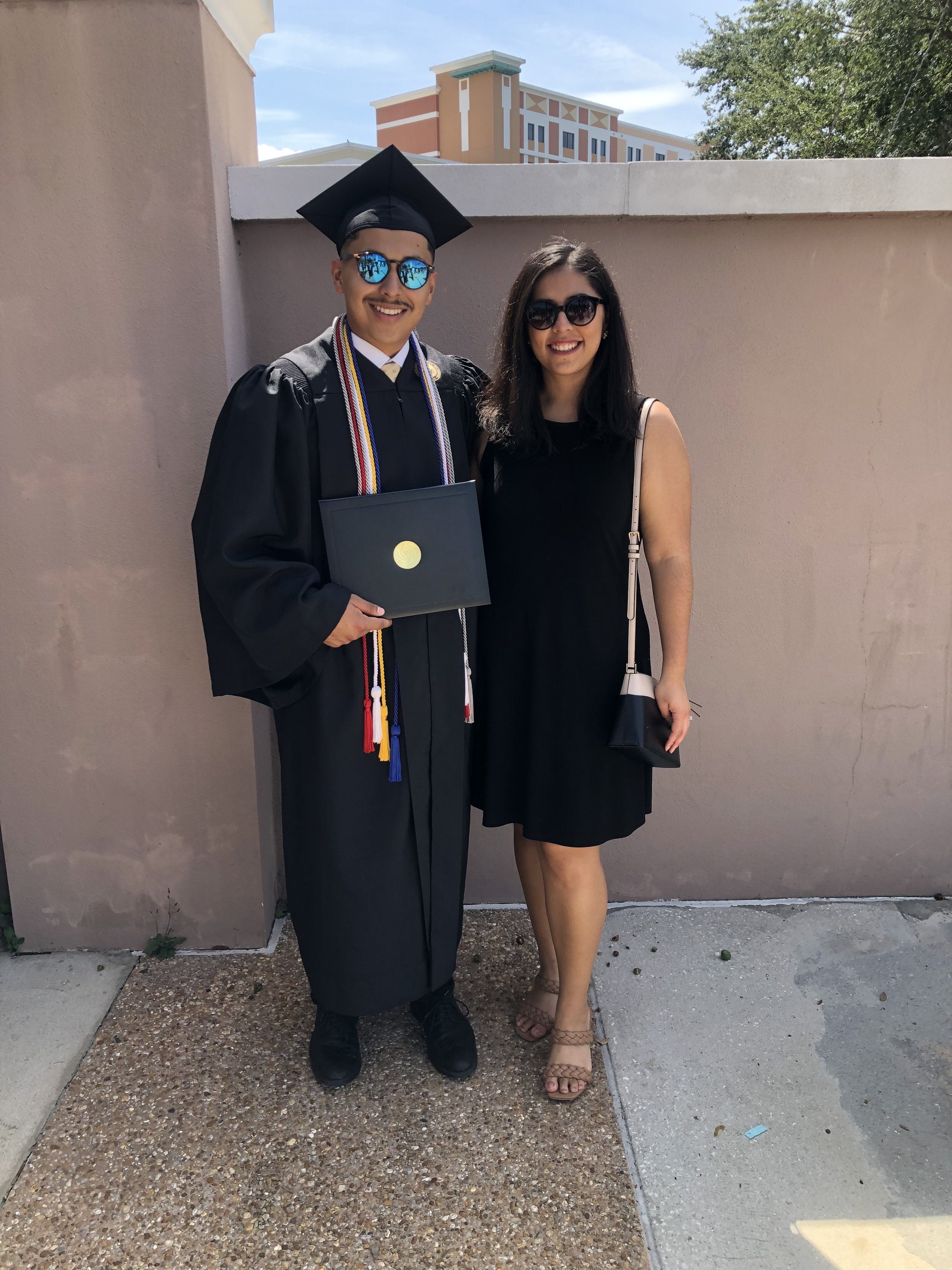 Jacqueline attends her younger brother’s graduation from the University of Central Florida. With Jacqueline’s help on college and scholarship applications, her brother was able to attend university on a full ride scholarship and even receive funding