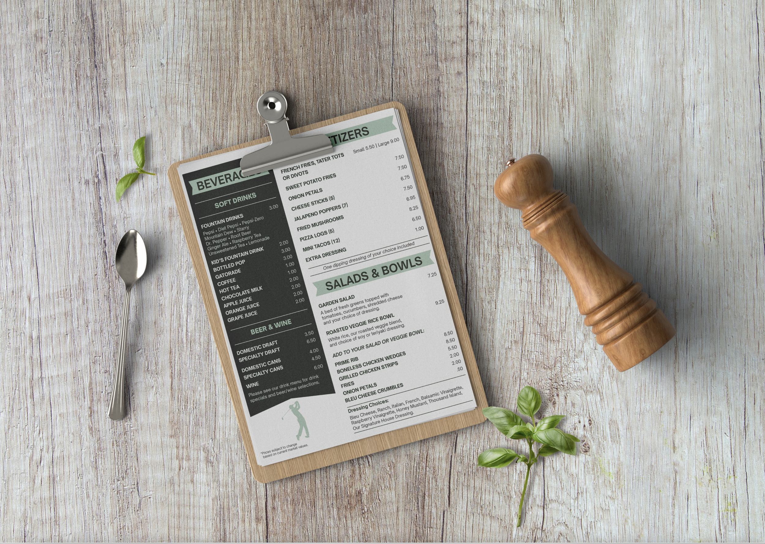 Restaurant menu on a wooden clipboard, a wooden pepper mill, a spoon, and green leaves on a light wood surface.