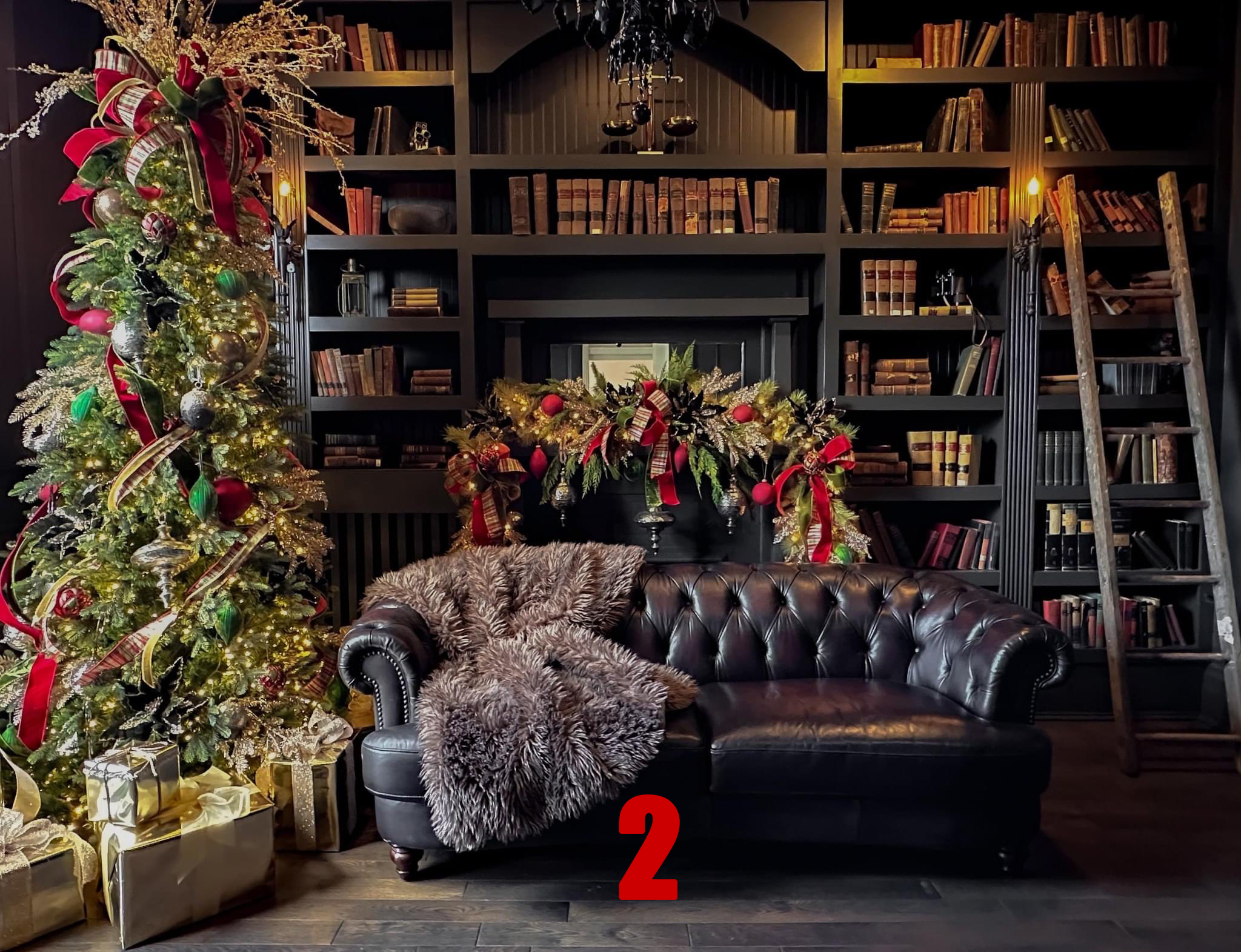 Decorated Christmas tree with ornaments and ribbons, presents underneath, a dark leather sofa with a furry blanket, festive garland on the wall, bookshelf, ladder, and warm lighting in a cozy room.