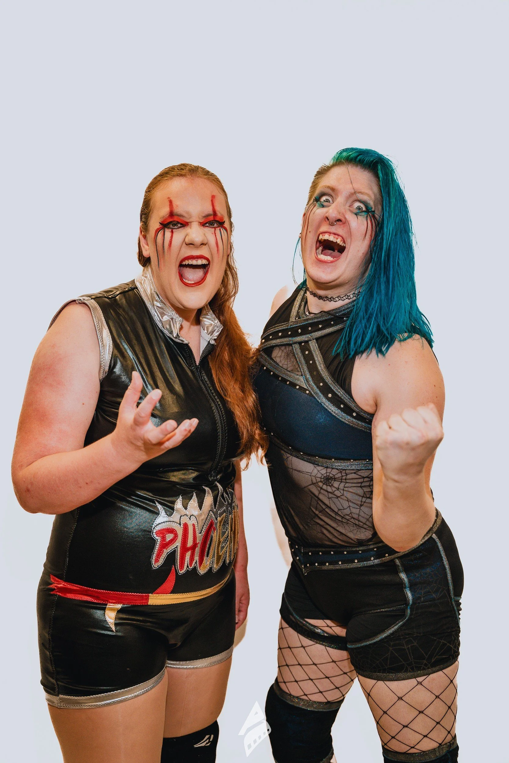 Expressive portrait of two performers.