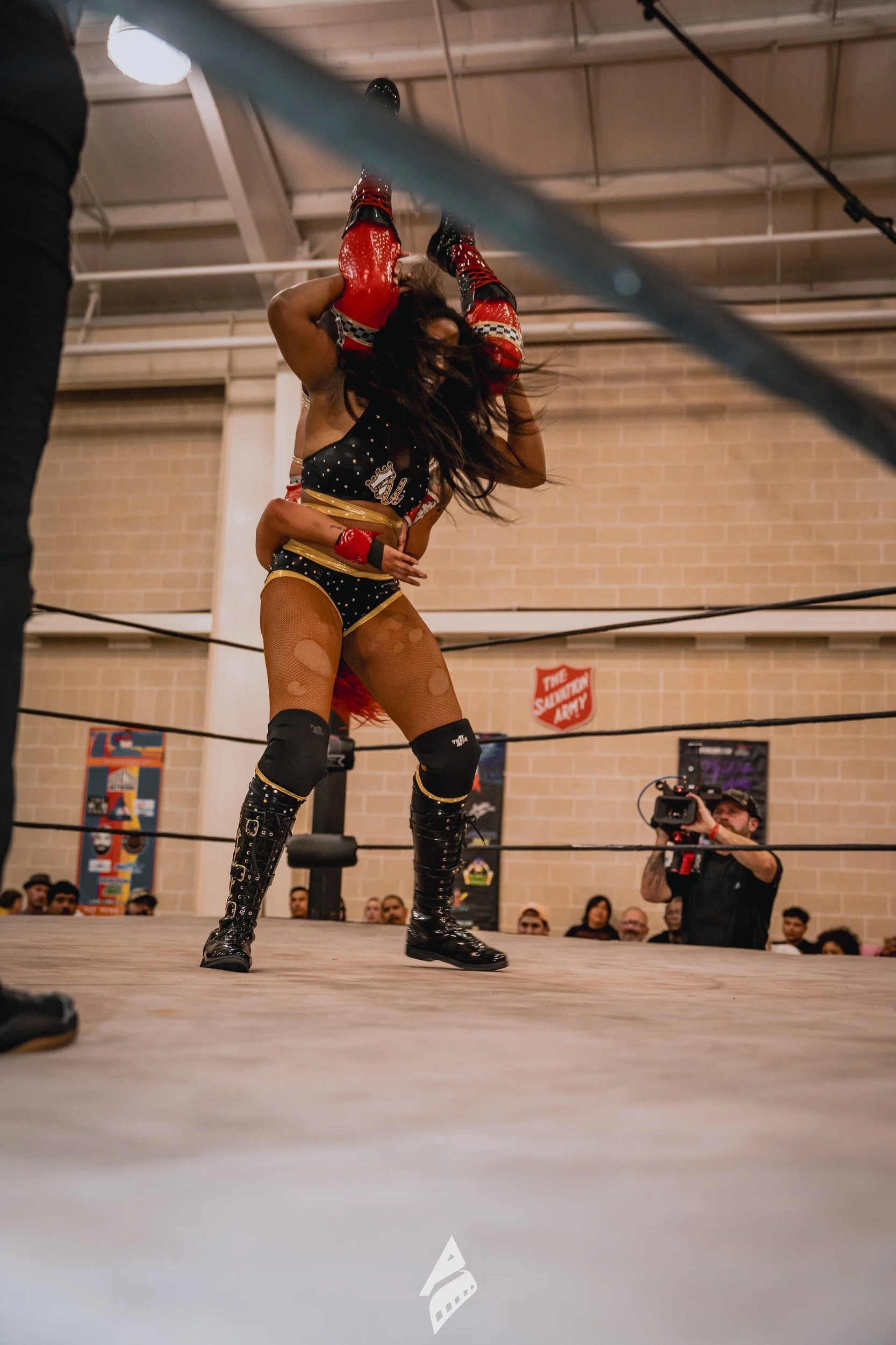 Wrestlers during an airborne move.