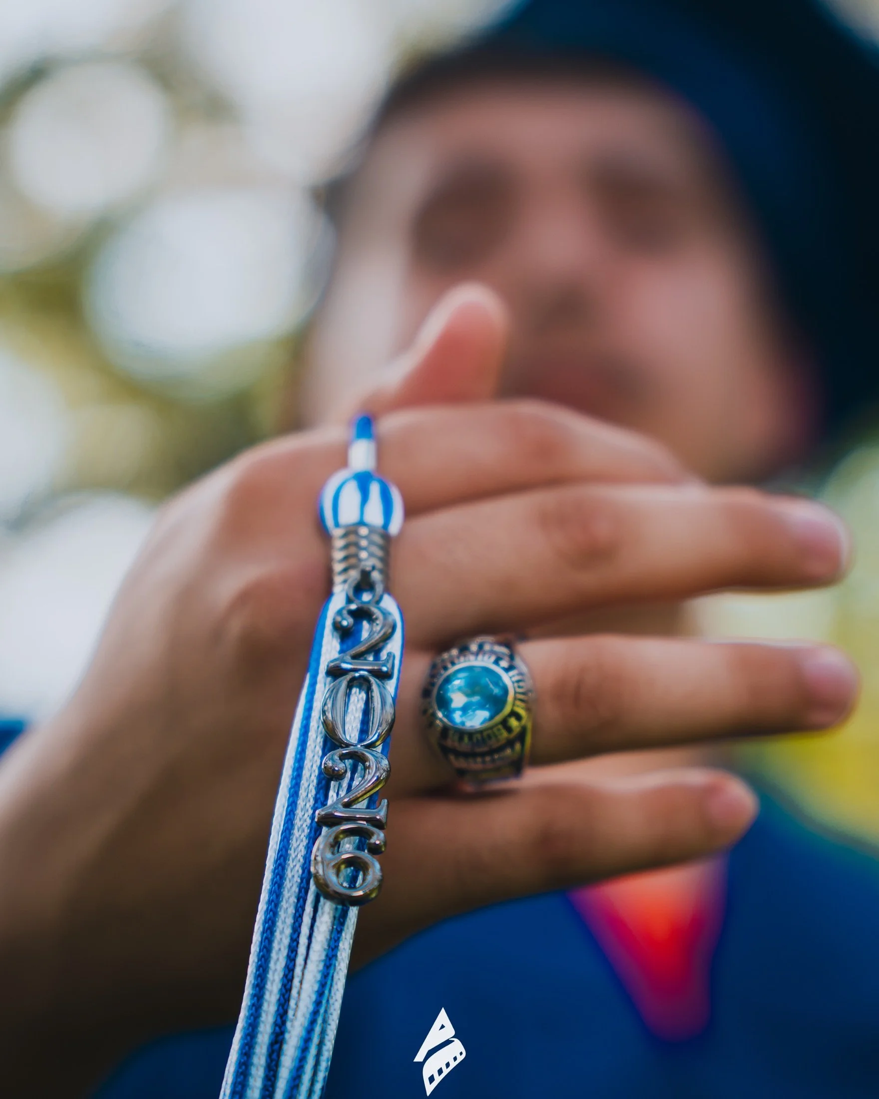 Close-up of a 2026 graduation tassel and class ring.