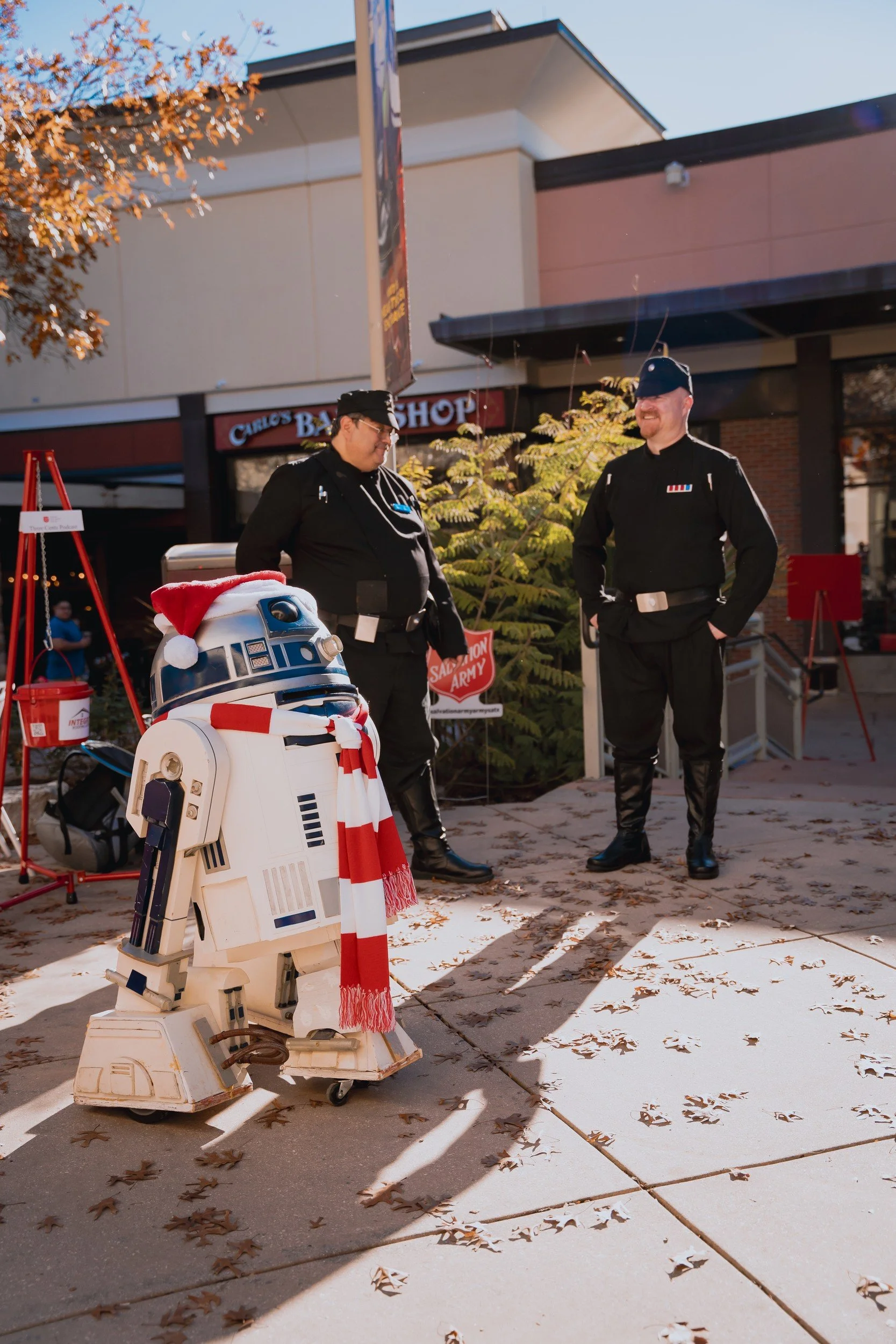 An attendee with a robot character at the event.