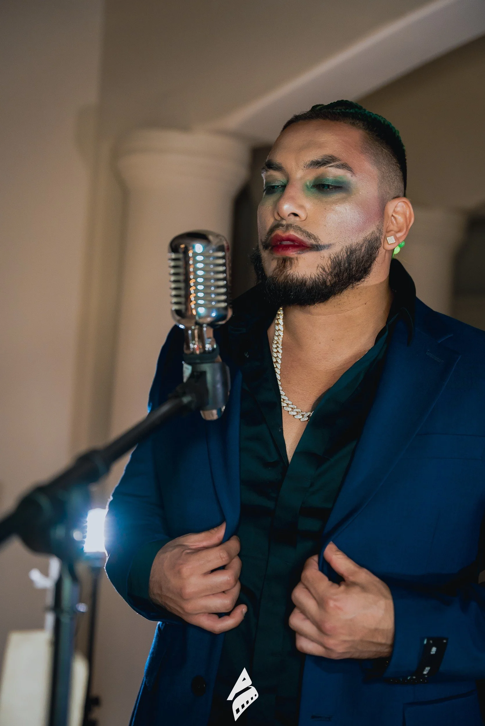 Close microphone portrait in performance styling.