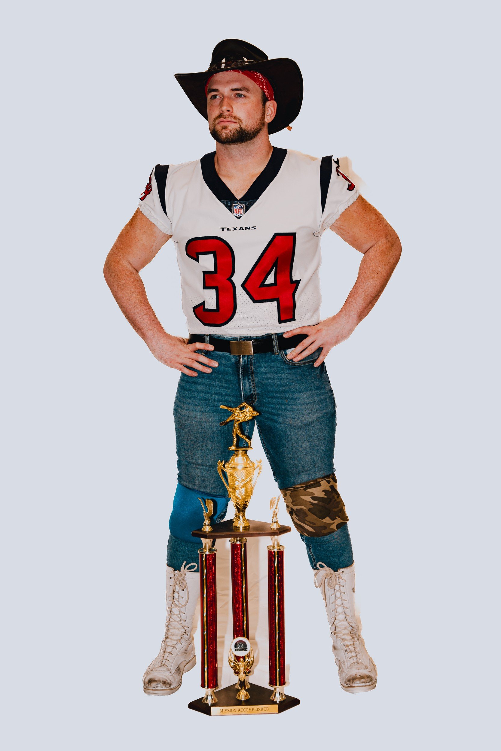 Performer with a trophy and cowboy styling.