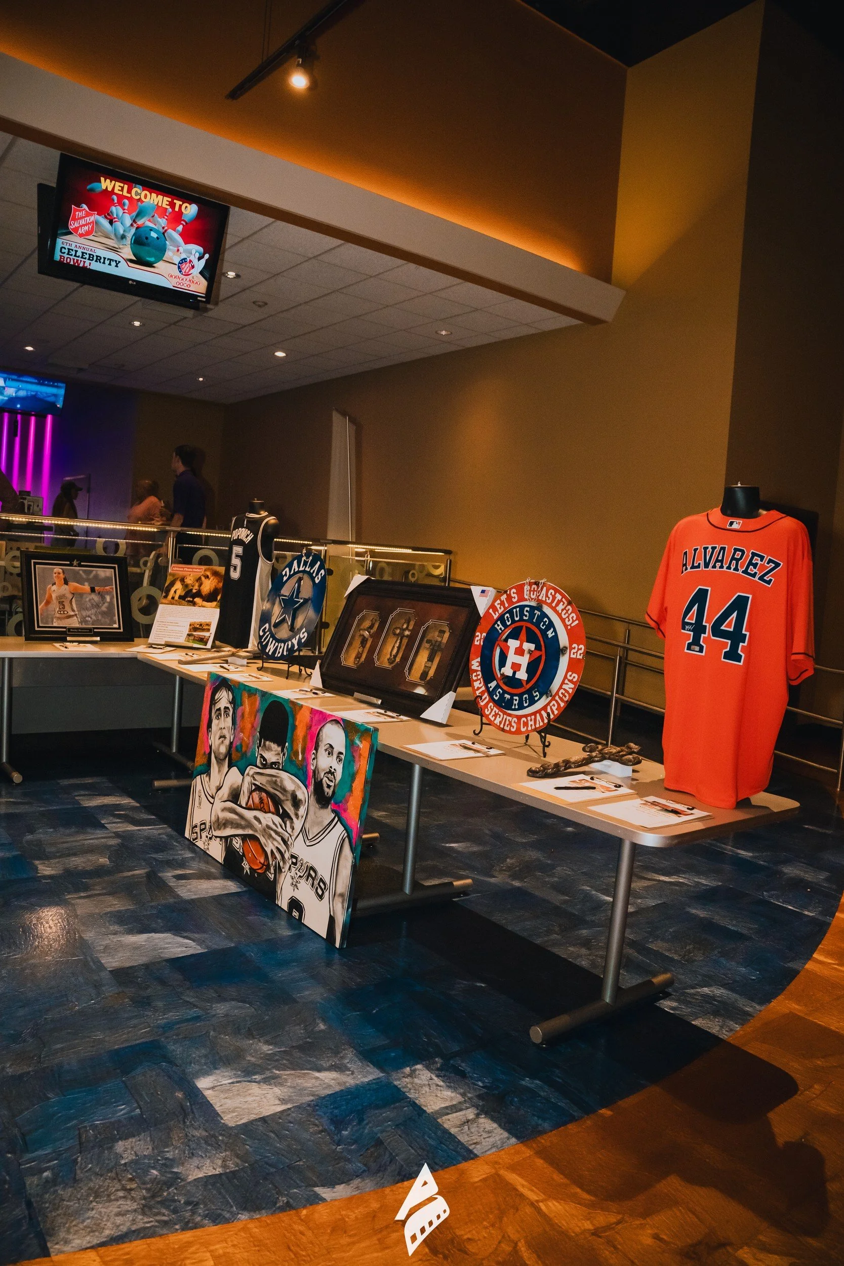 Wide view of auction displays at the event.